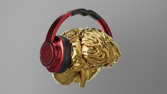 A pair of headphones that are gold and red