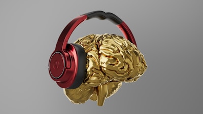 A pair of headphones that are gold and red