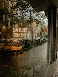 A window with a sign that reads collab connection co