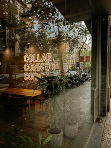 A window with a sign that reads collab connection co