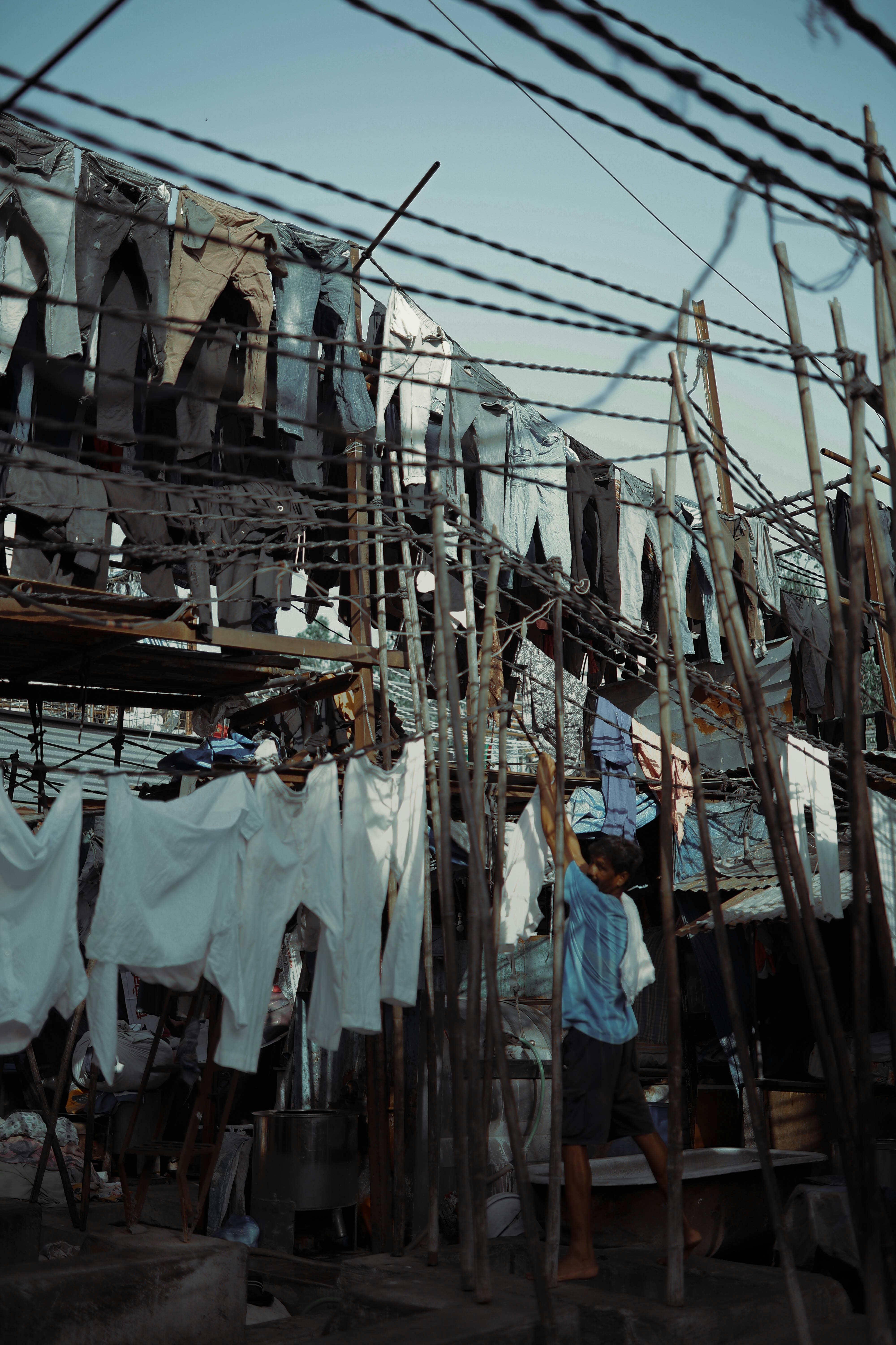 A bunch of clothes that are hanging on a wire