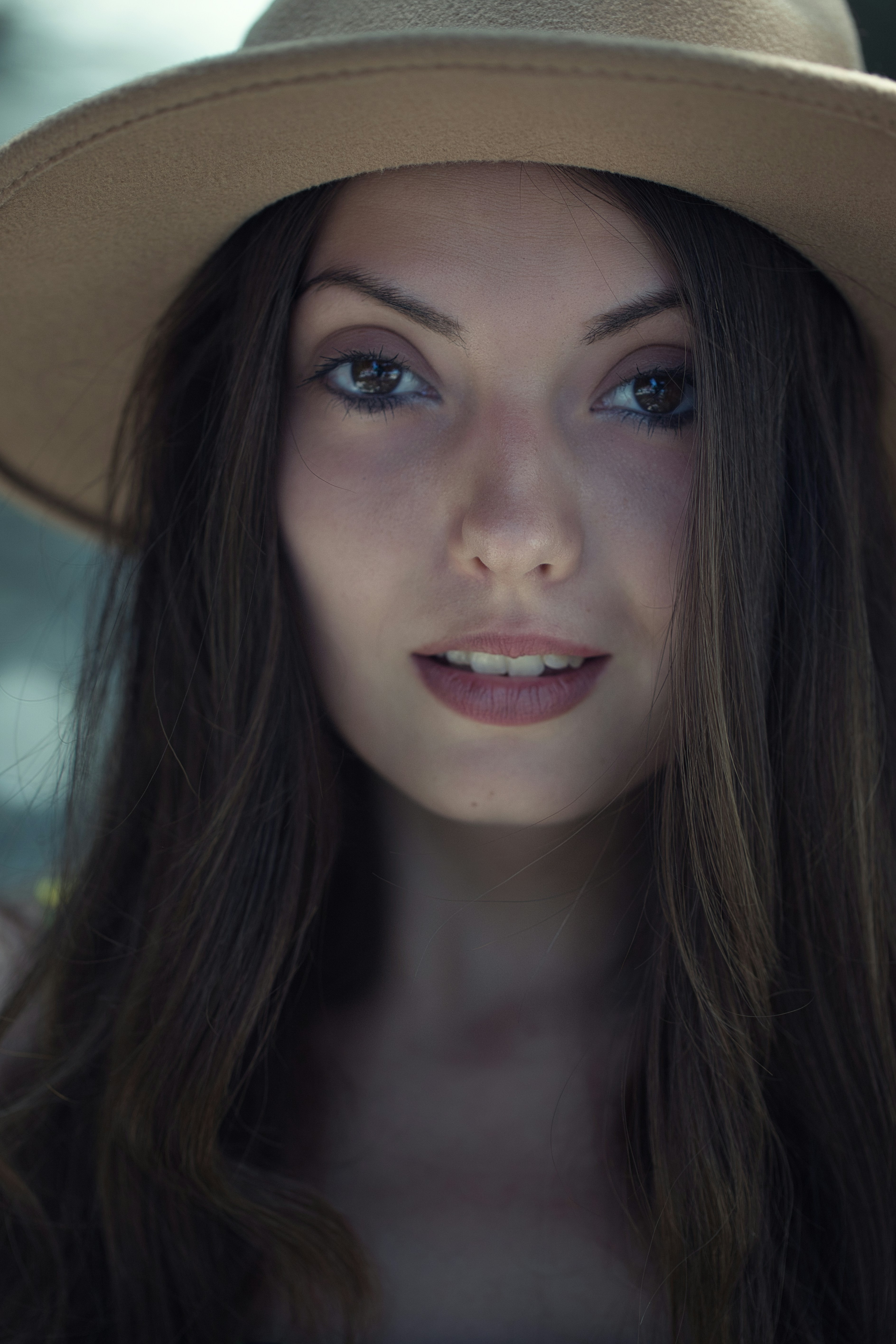 A woman wearing a hat and posing for a picture