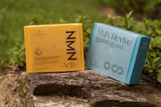 A couple of books sitting on top of a log