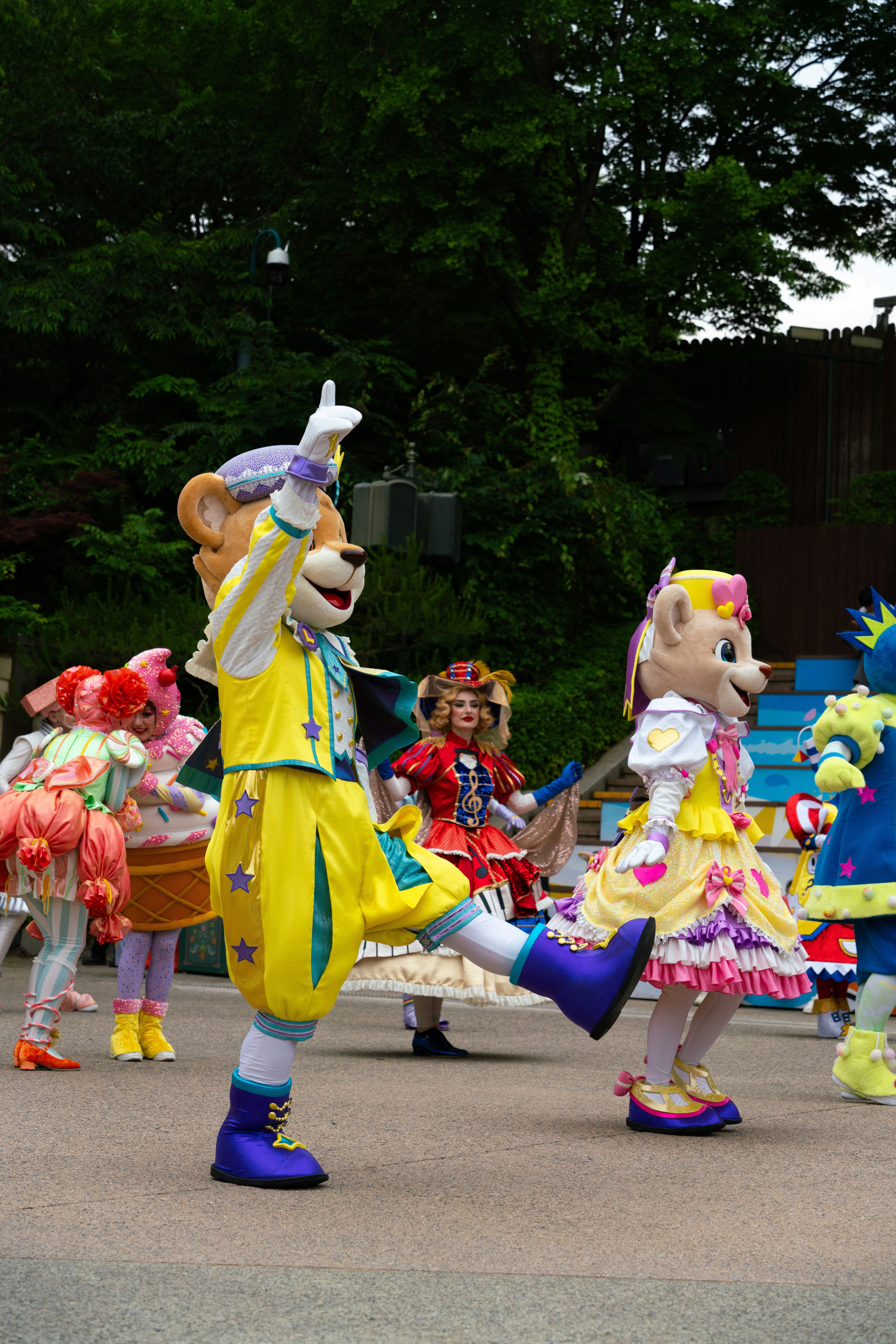 A group of people in costume dancing on a street