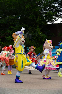 A group of people in costume dancing on a street