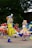 A group of people in costume dancing on a street