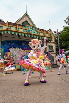 A group of people in costume dancing in front of a building