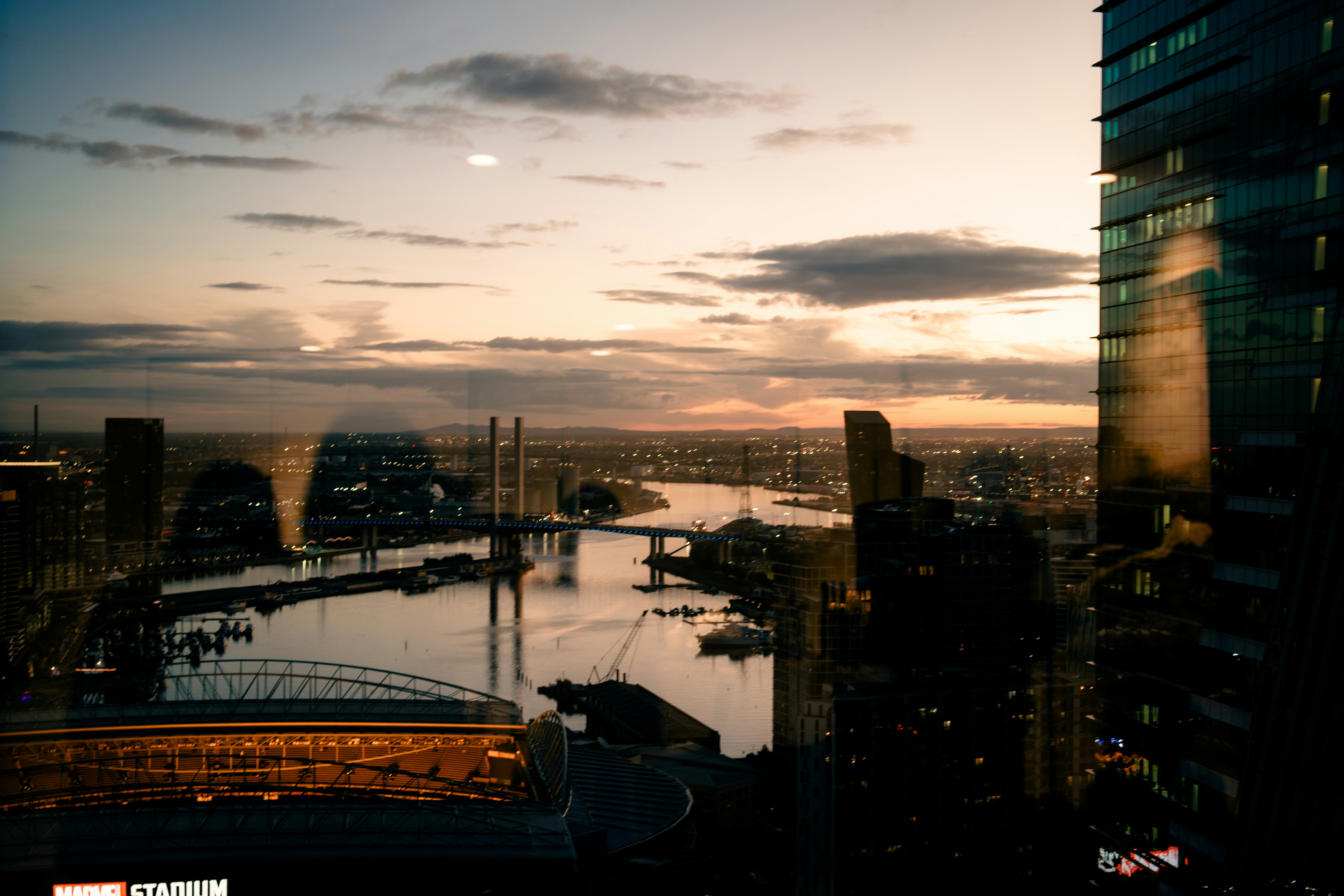 A view of a river and a city at sunset