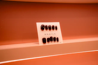 A display of nails on a shelf in a bathroom