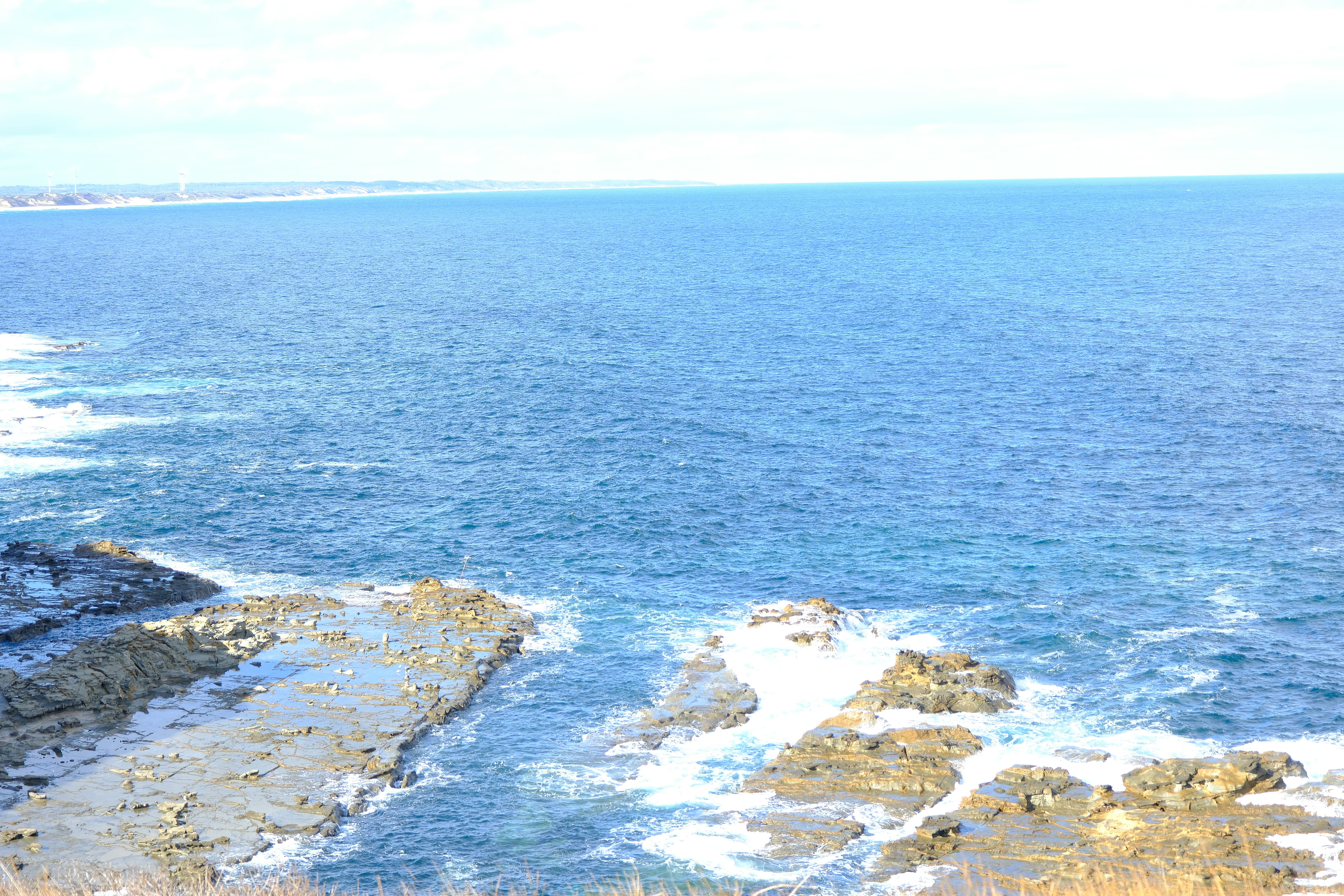 A view of a body of water from a cliff
