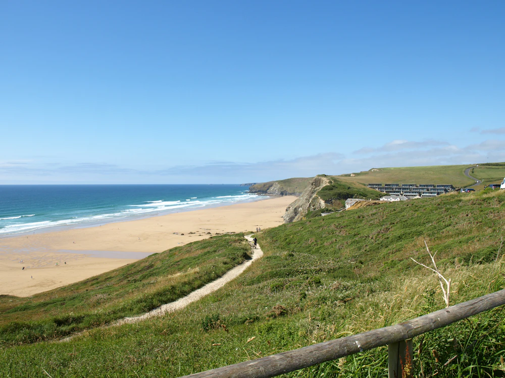The long sandy beach at Watergate Bay, seen from the cliff path