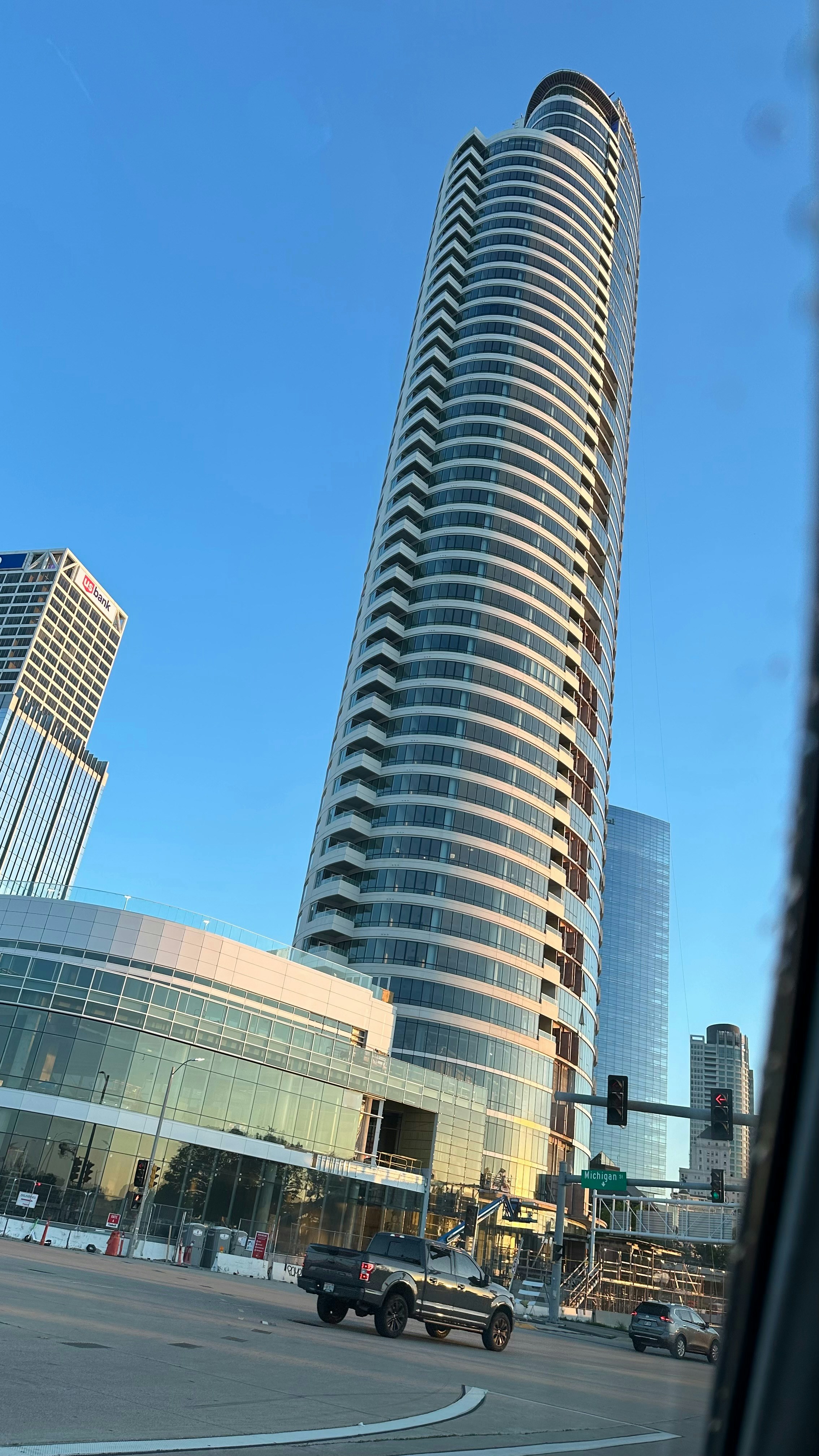 Modern passenger vessel hull design with blue water background showing complex curved surfaces