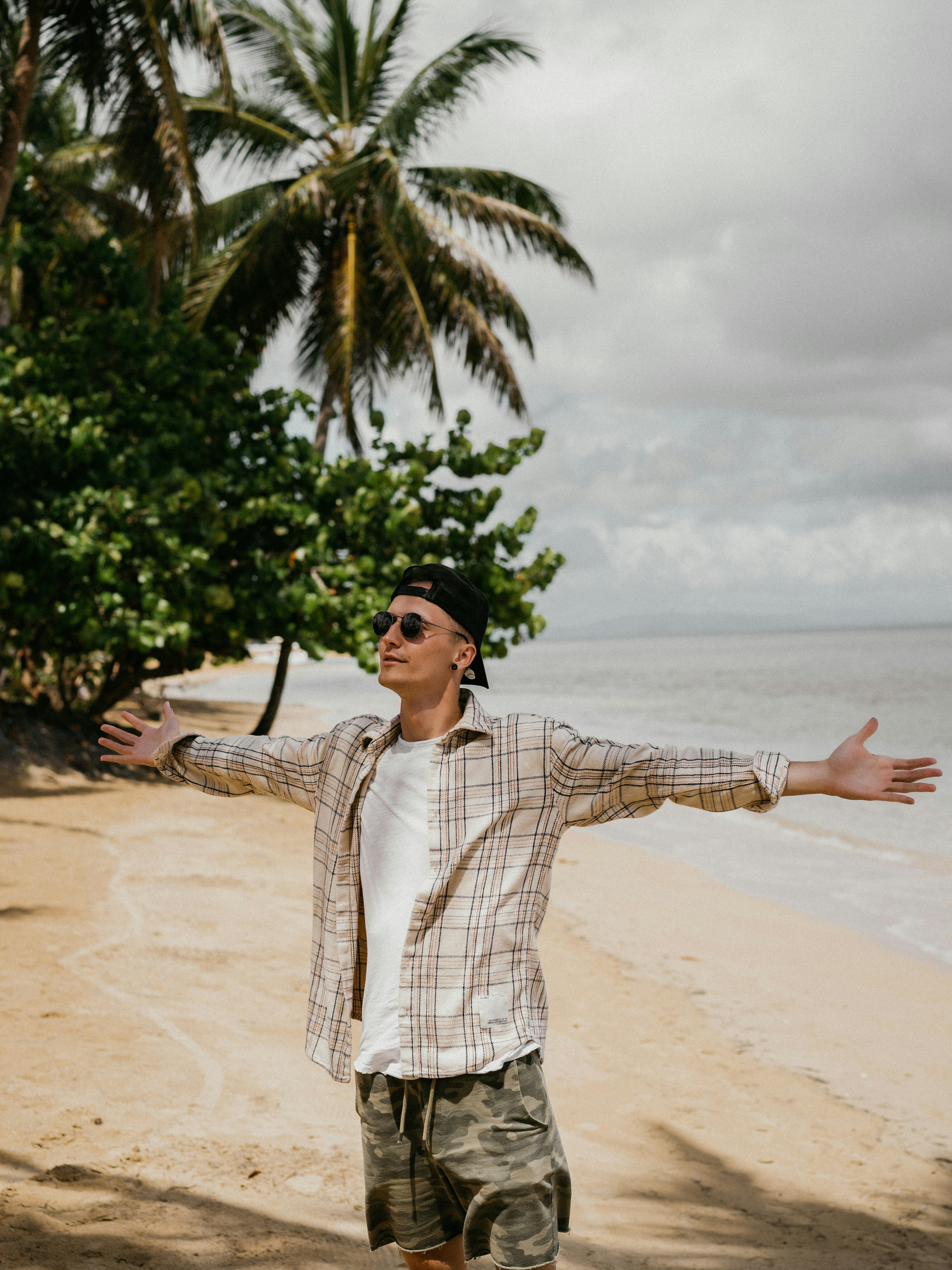 A man standing on top of a sandy beach