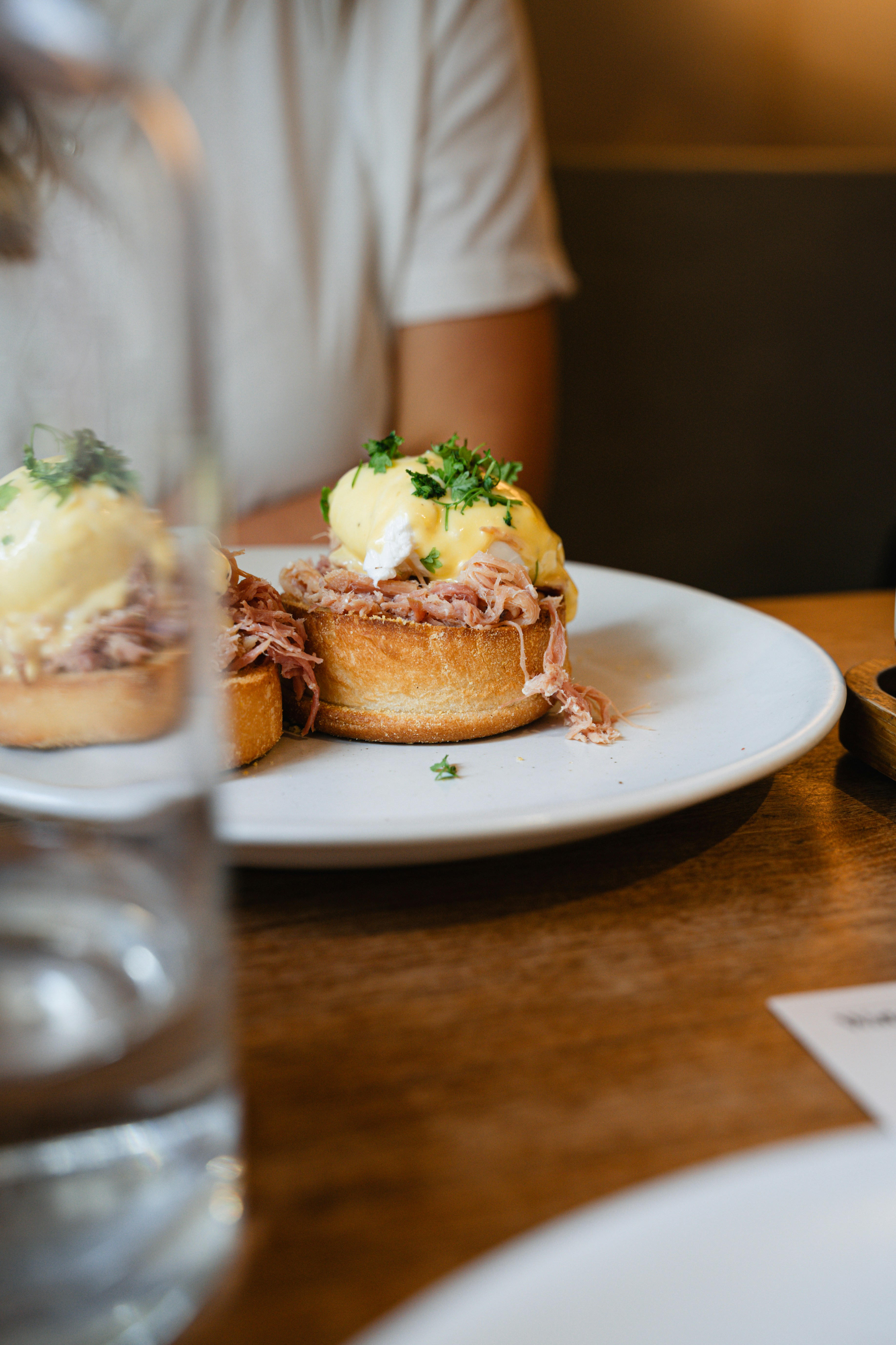 A beautiful brunch at Watch House as seen partially through a glass.