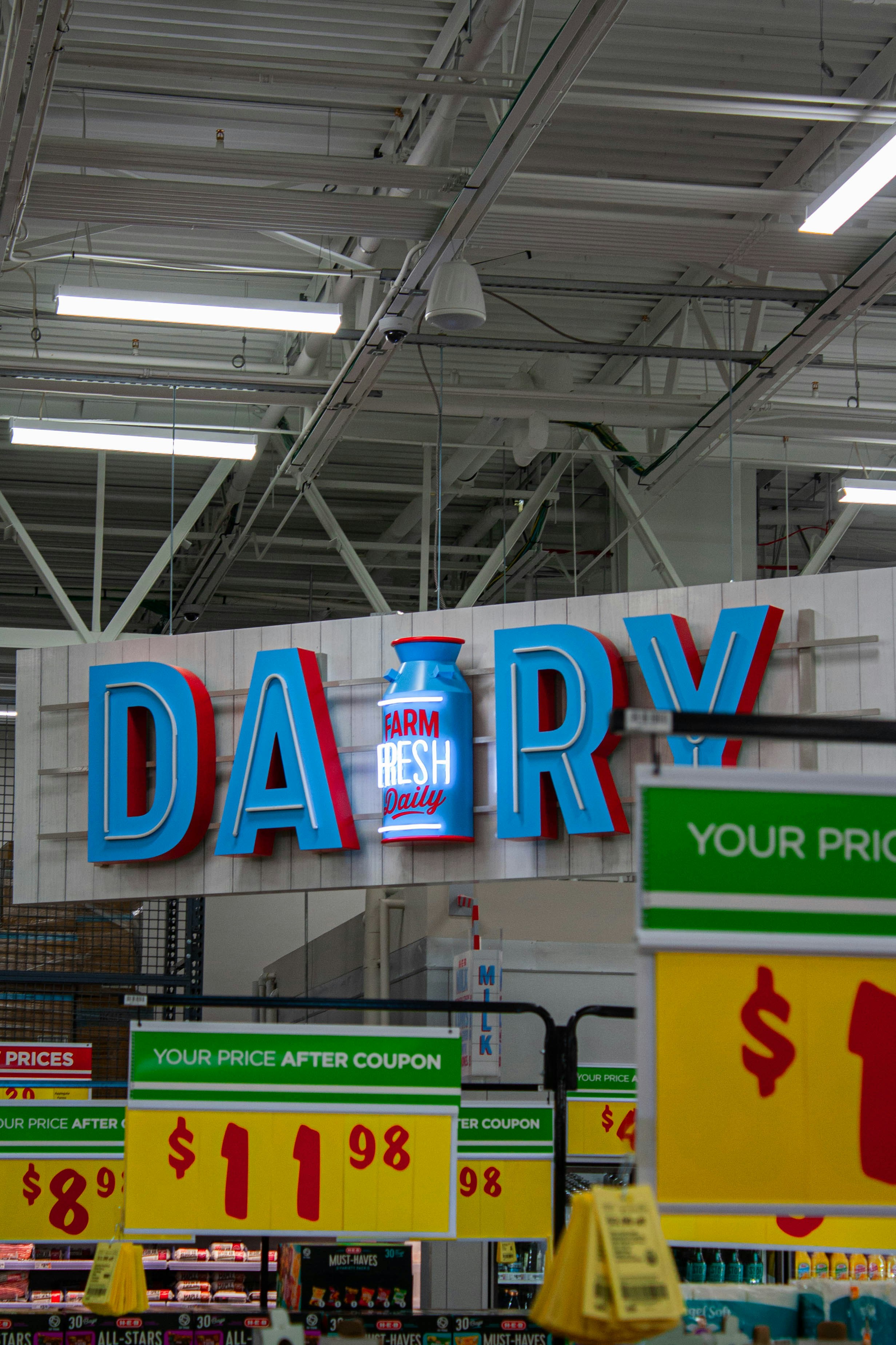 A dairy store sign hanging from the ceiling