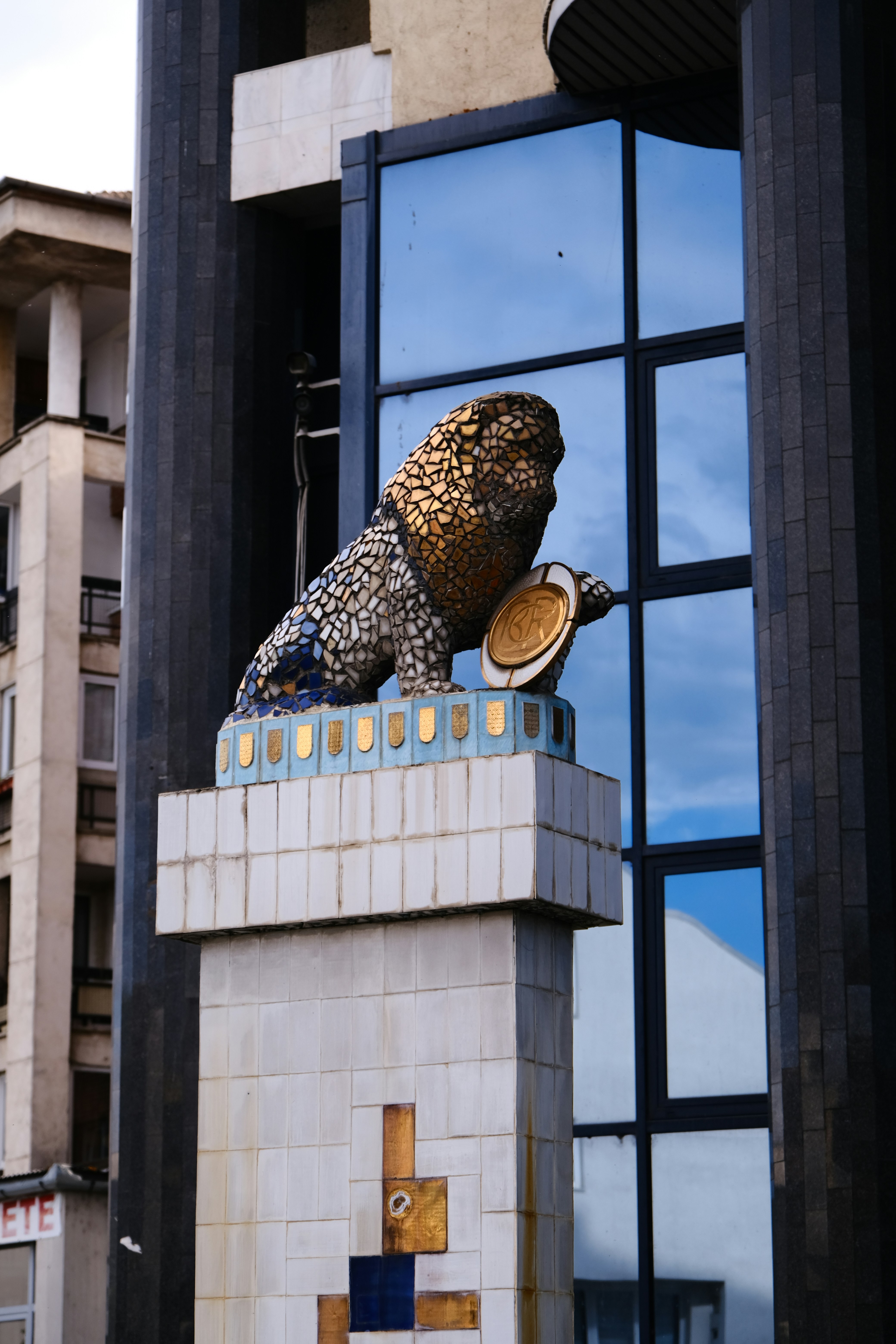 A statue of a lion on top of a building