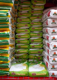 A grocery cart filled with lots of bags of food