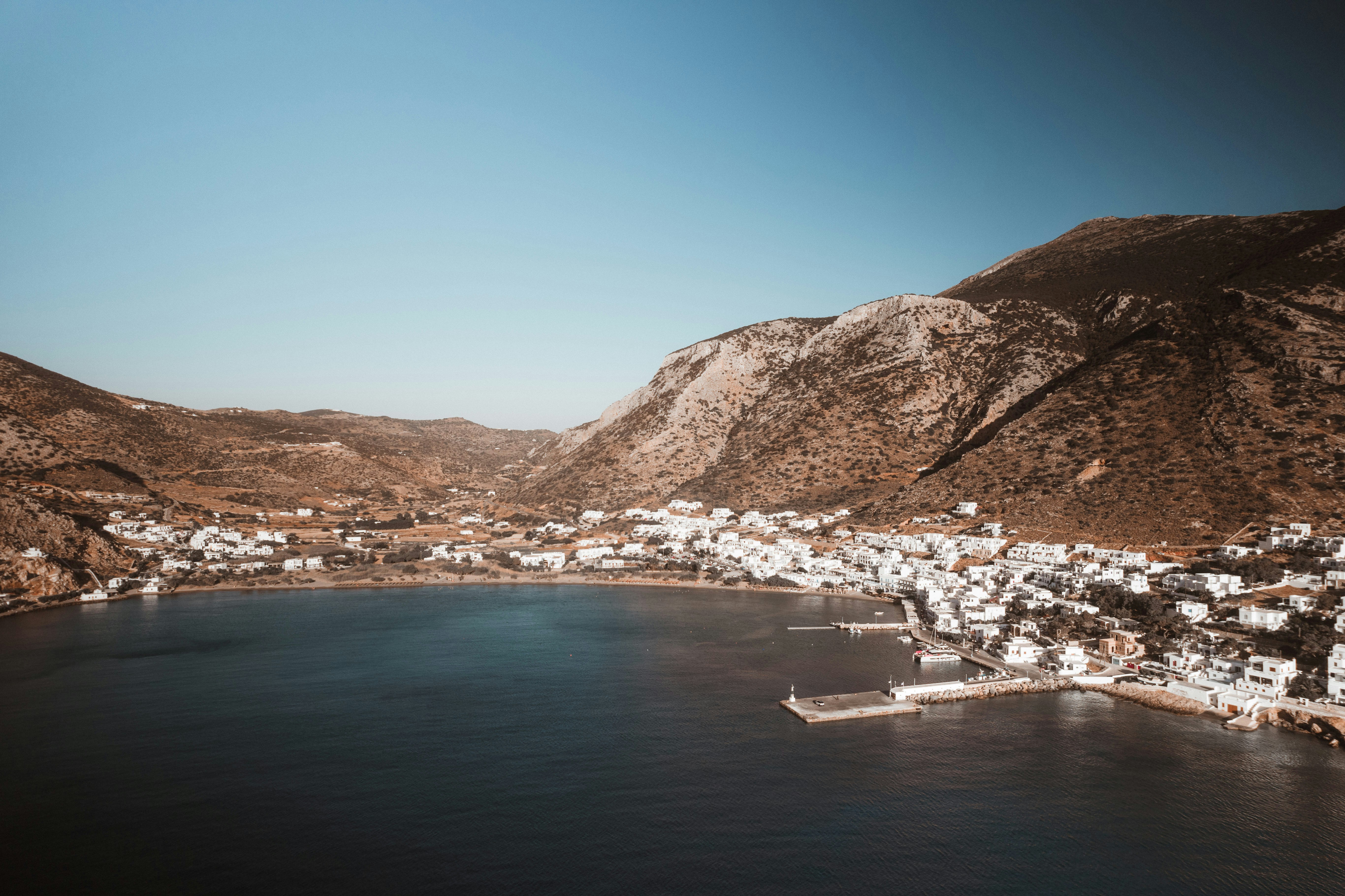 An aerial view of a town and a lake