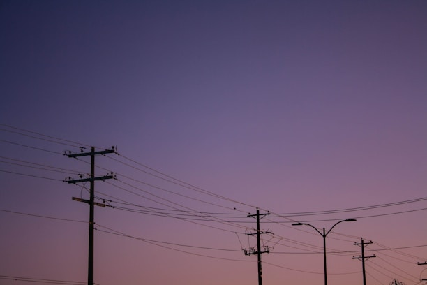 A row of telephone poles sitting next to each other