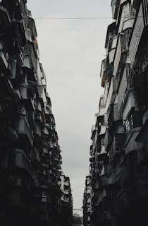 A couple of tall buildings sitting next to each other