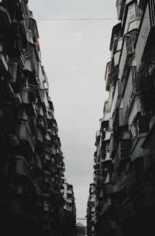 A couple of tall buildings sitting next to each other