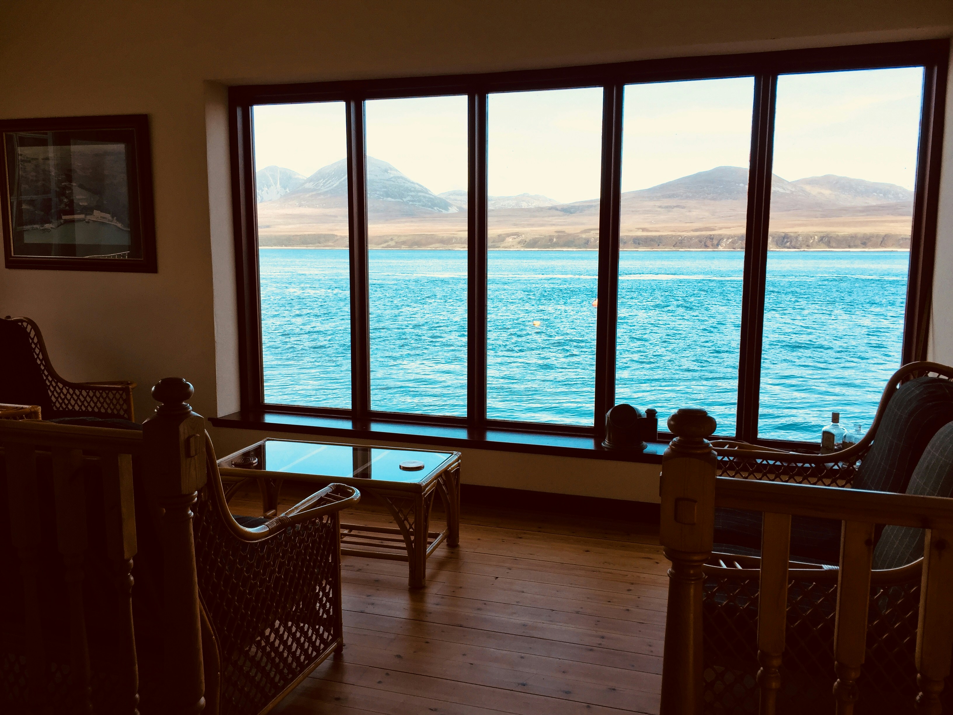 A living room filled with furniture and a large window