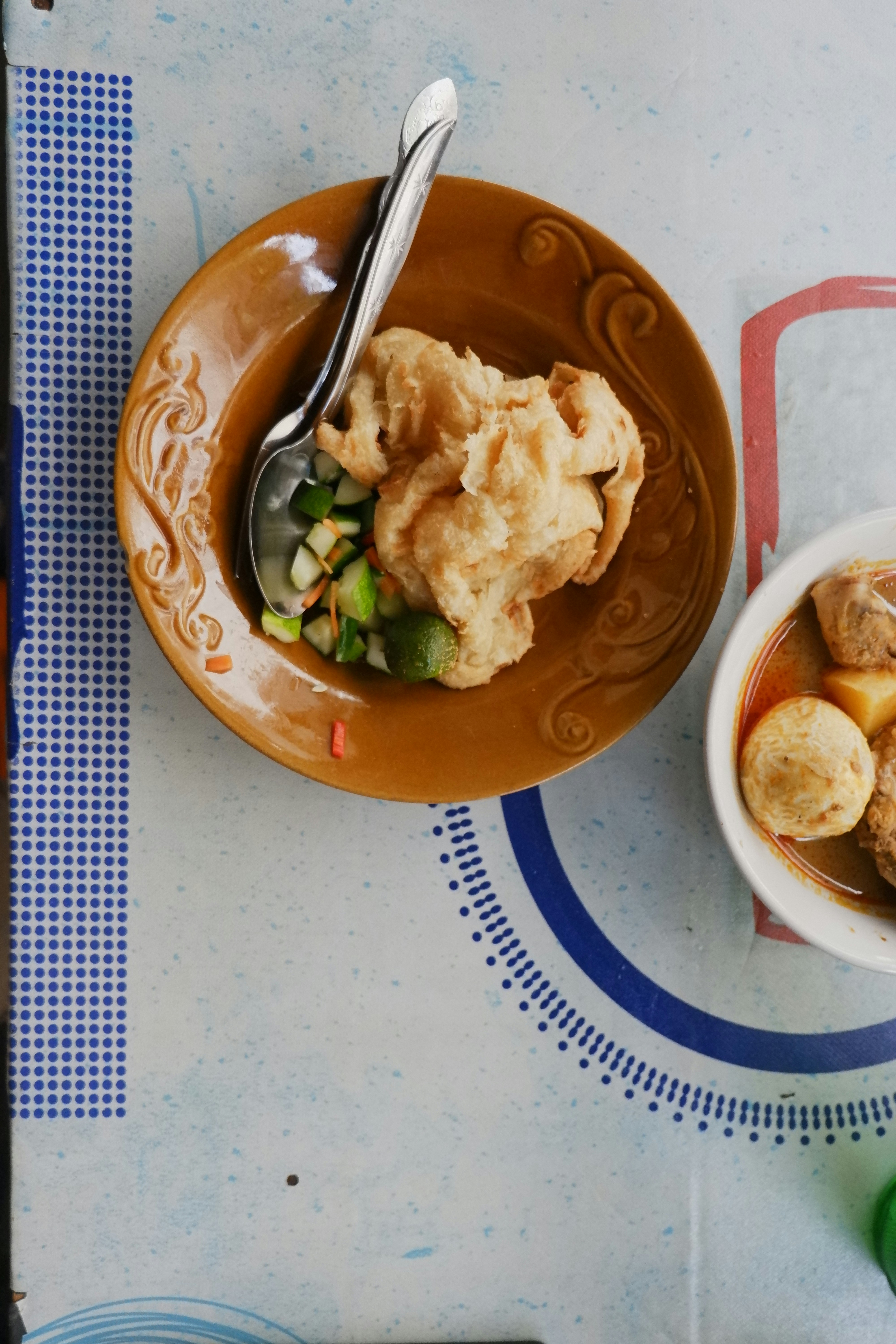 Two bowls of food are on a table