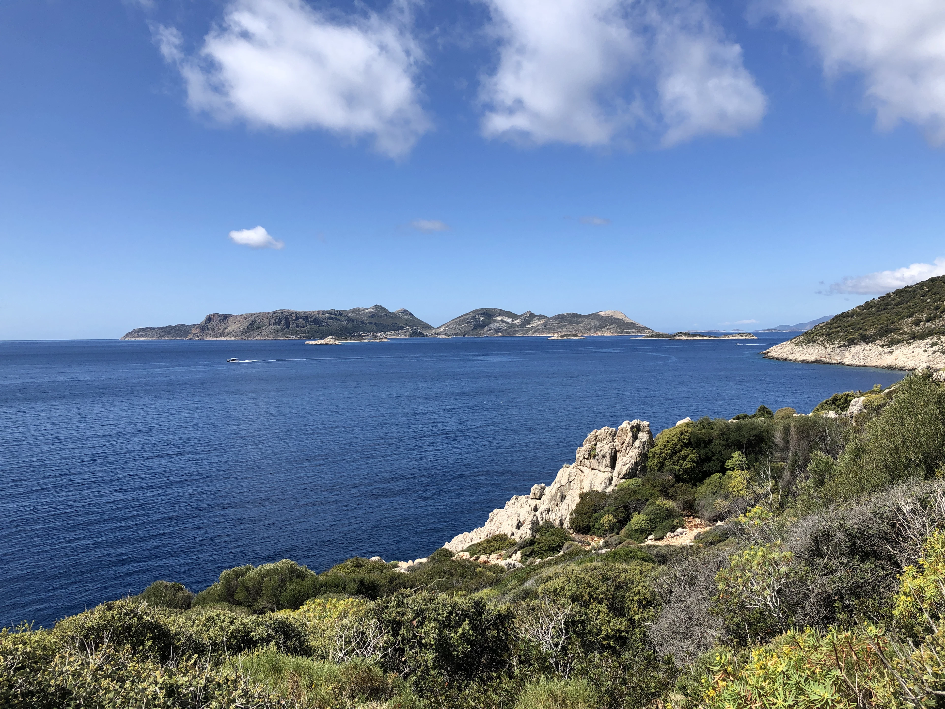 Blue sea, a rocky headland and islands seen from the Lycian Way, Turkey