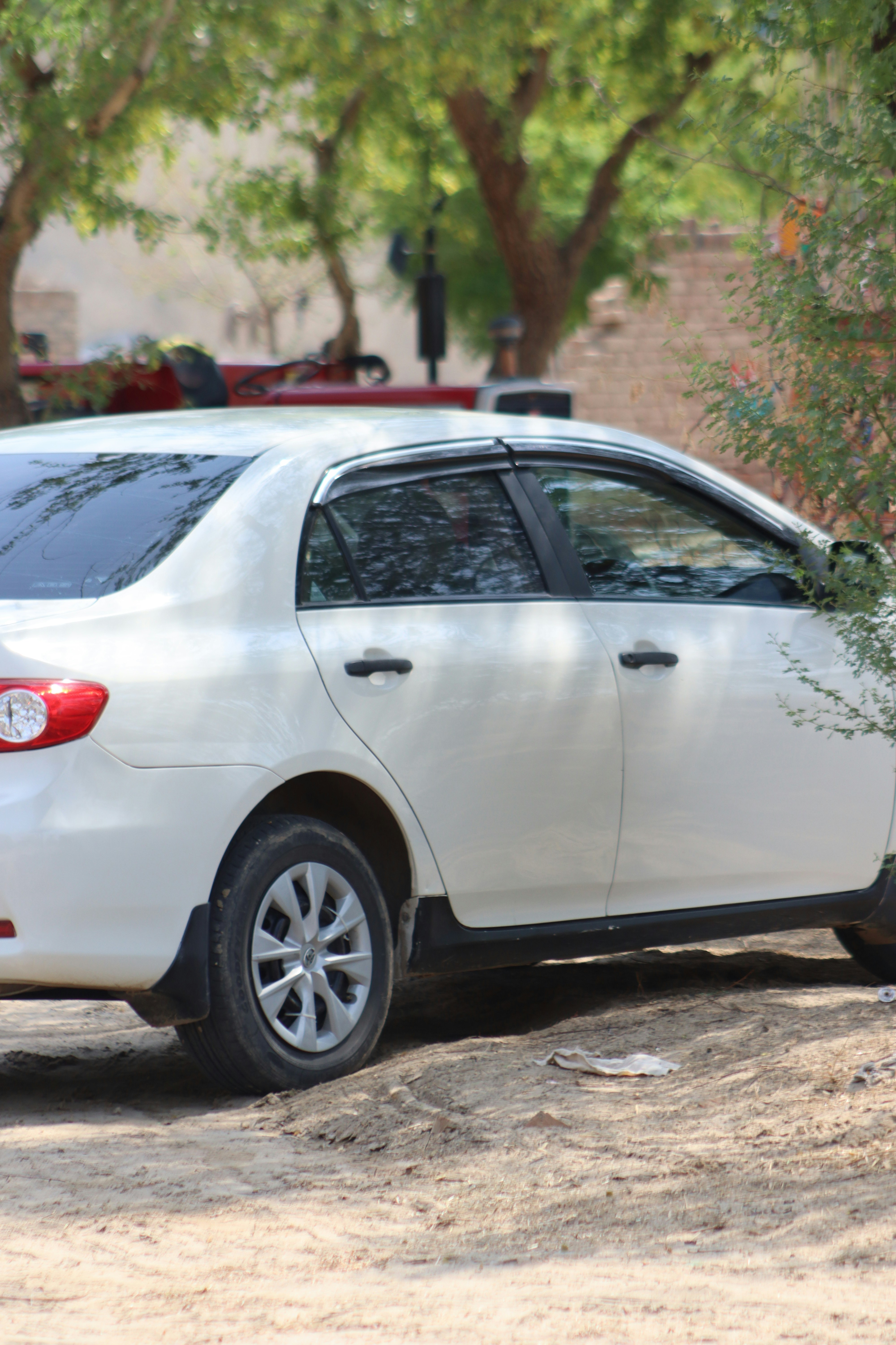A white car parked on the side of the road photo – Free Car Image on ...