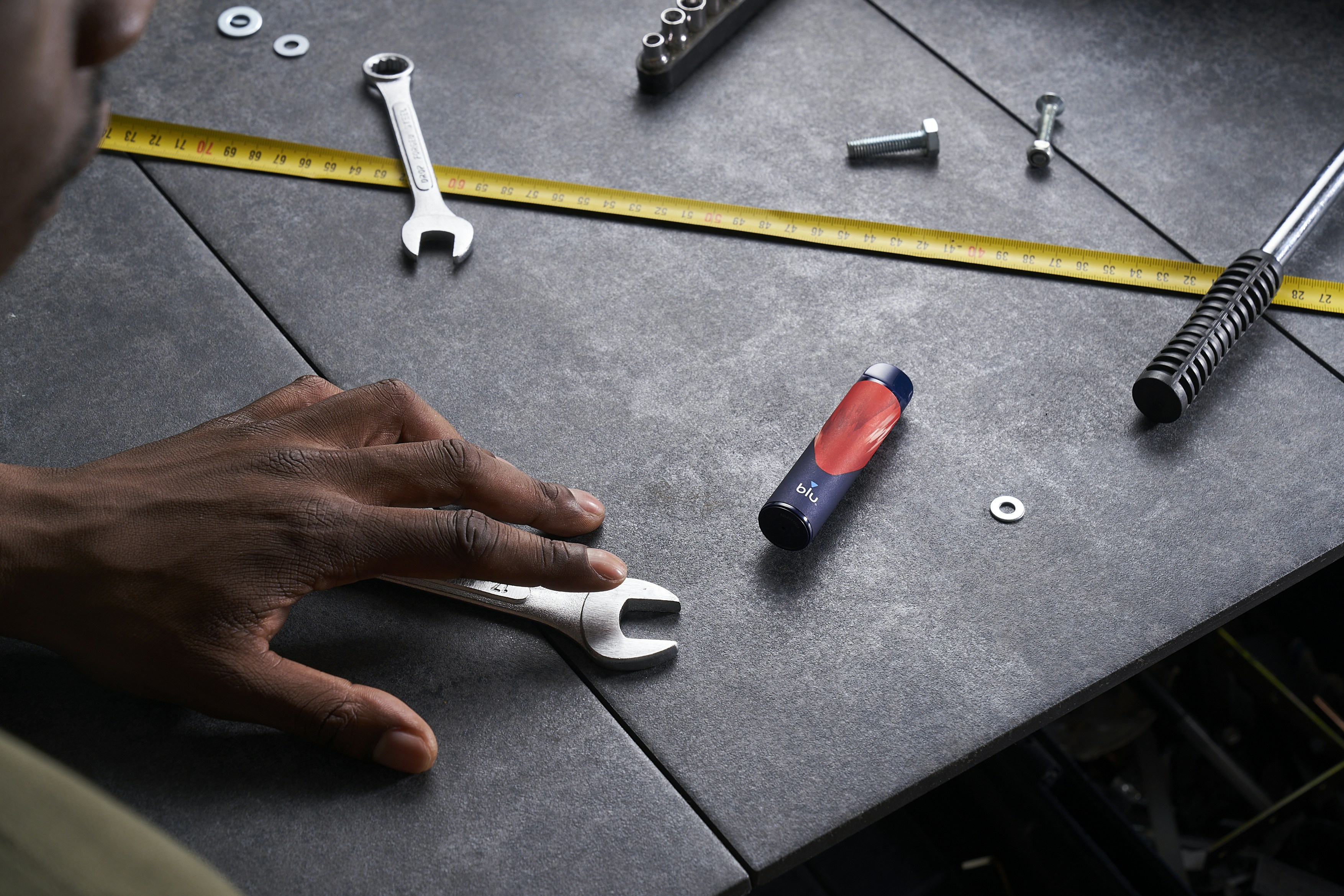 A man working on a table with tools