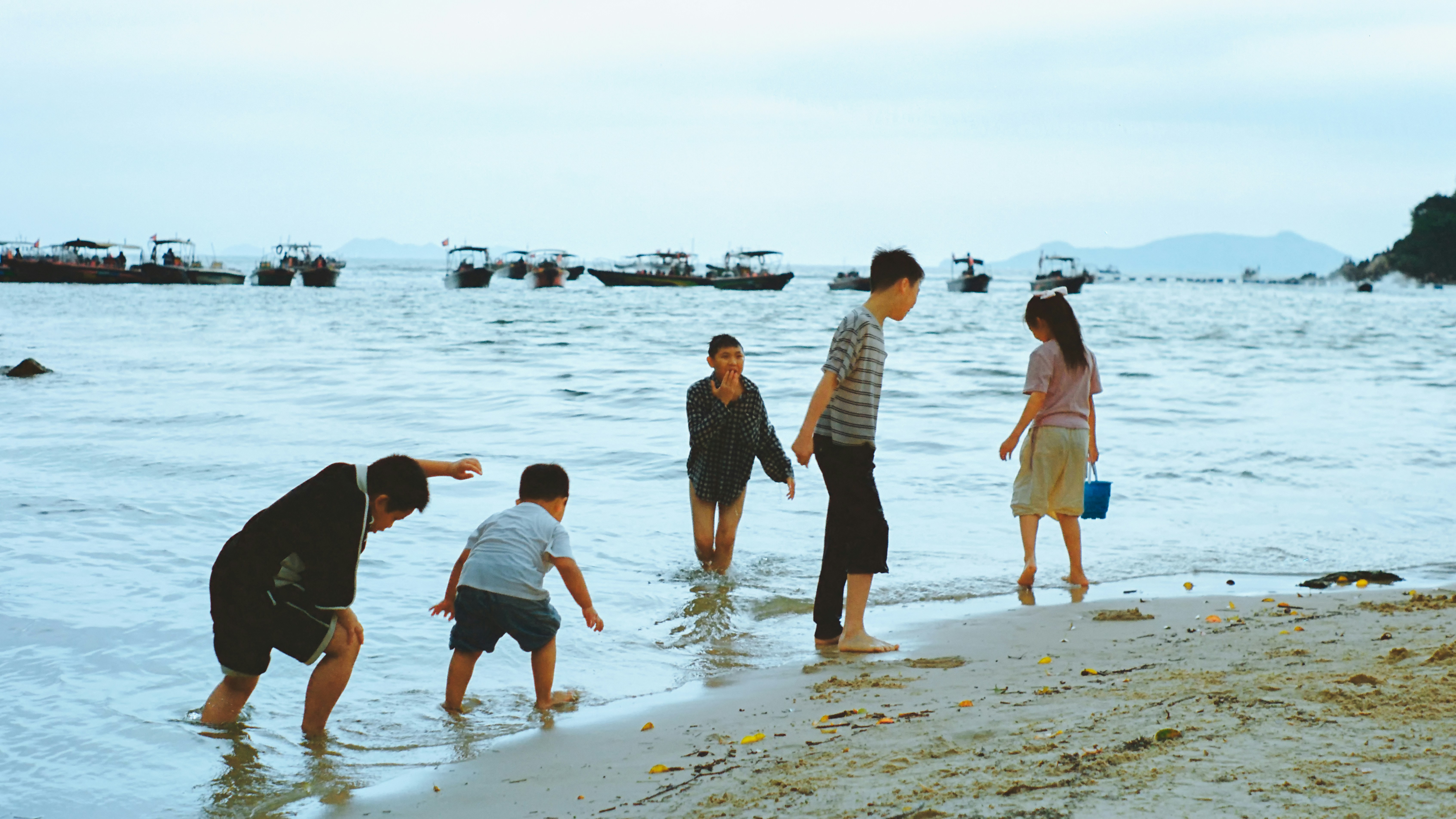 A family enjoying a bonding moment on vacation, engaged in a shared activity.