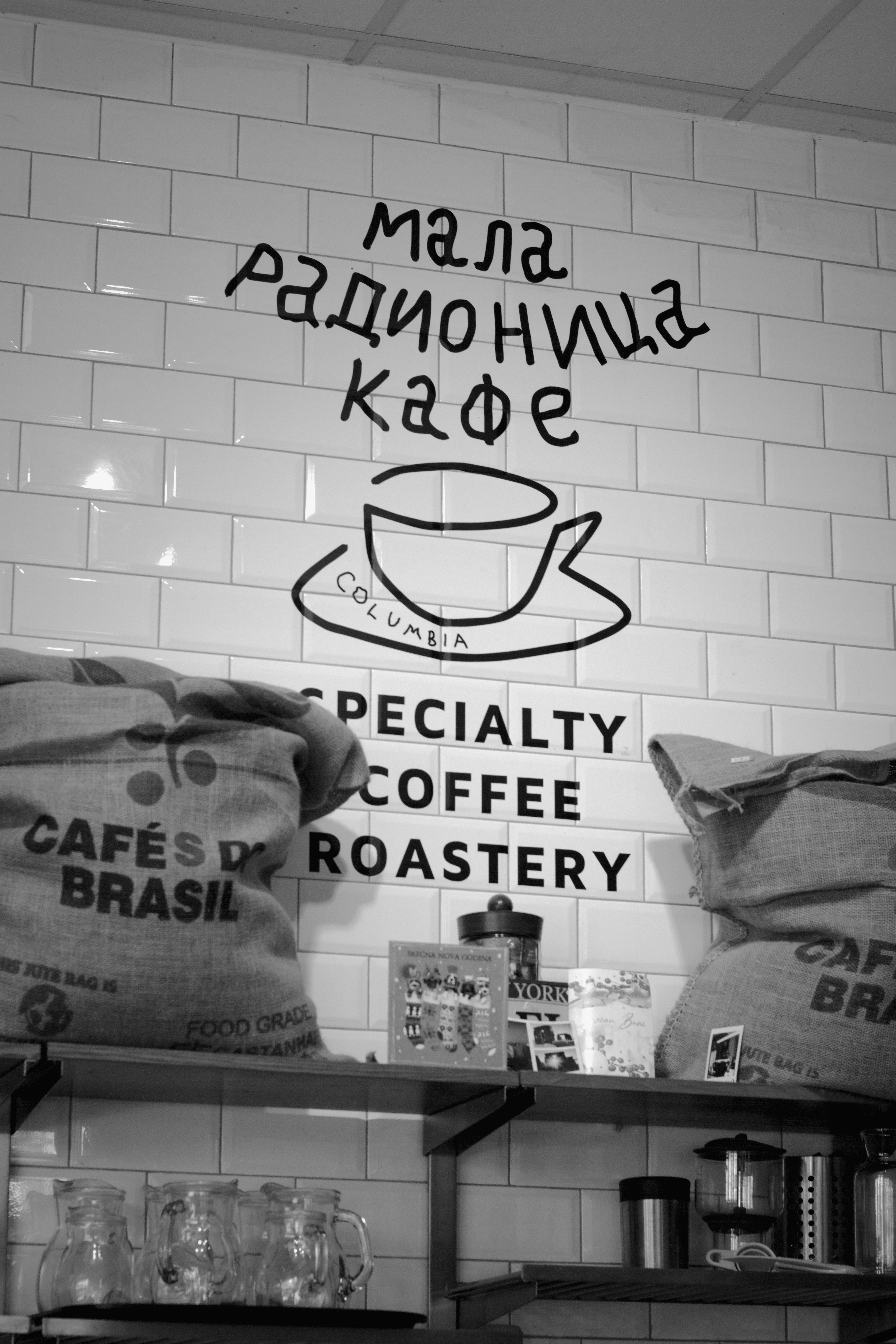 A coffee shop with bags of coffee on the counter