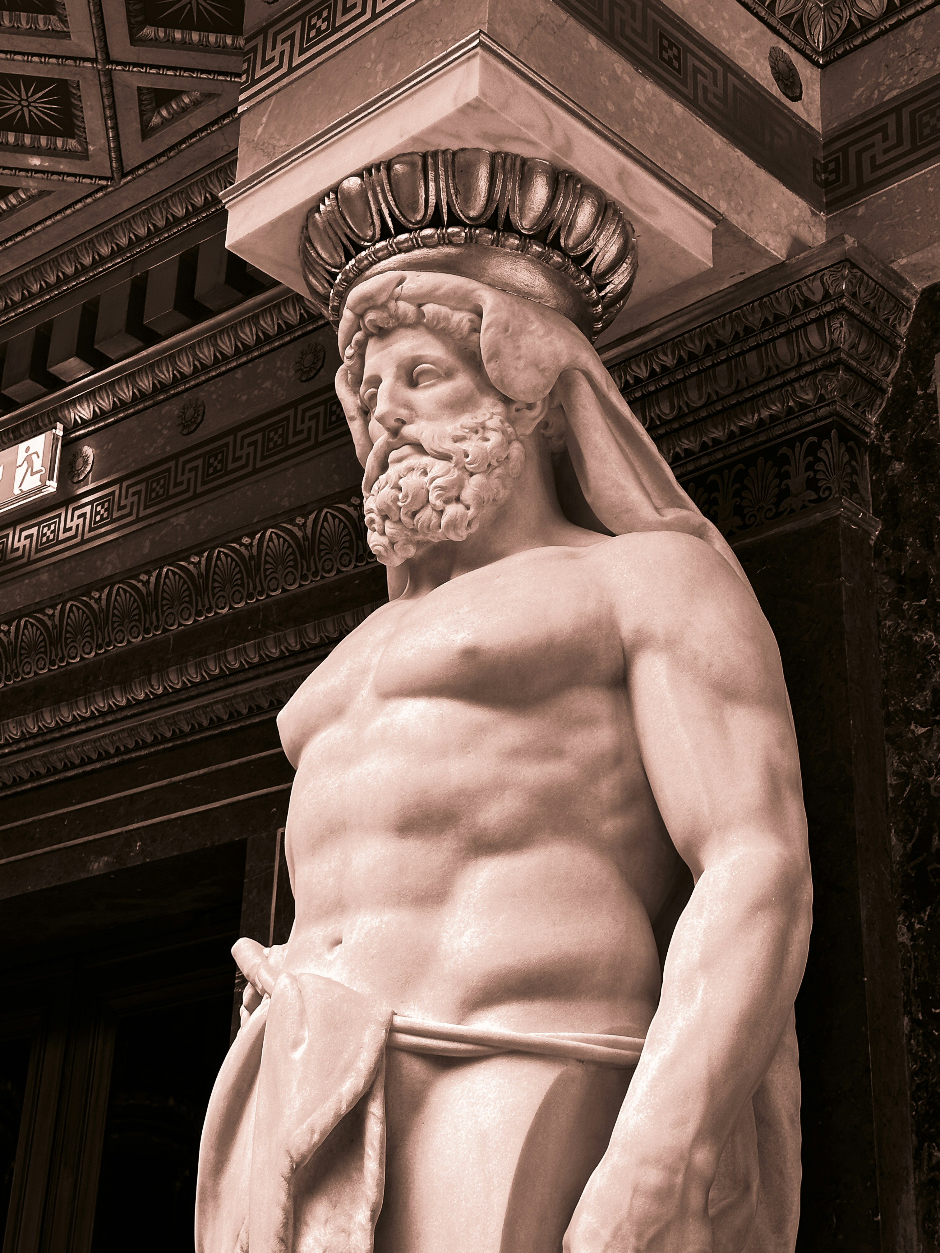 A statue of a man with a beard wearing a robe