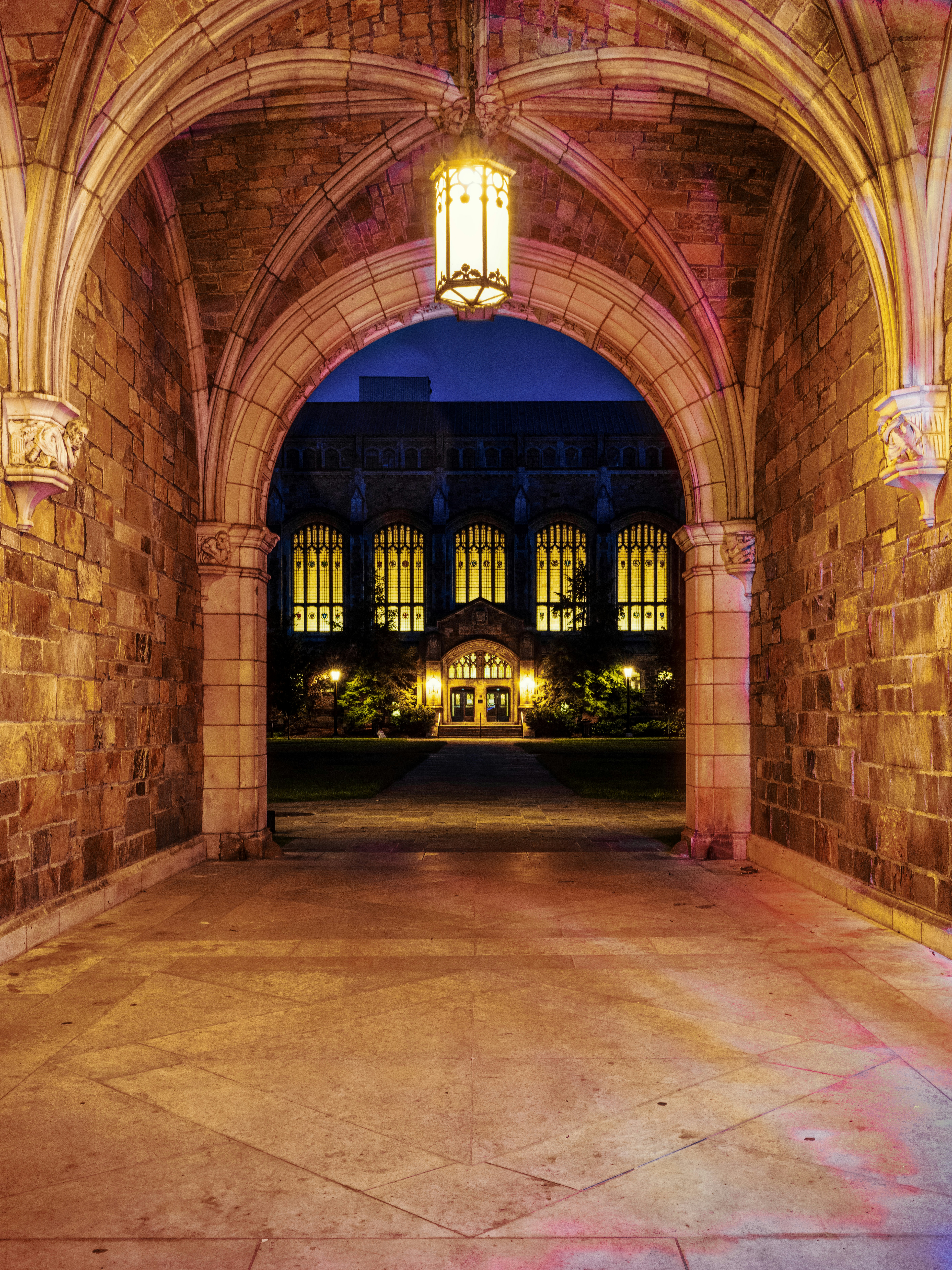A large stone building with a clock on the front of it