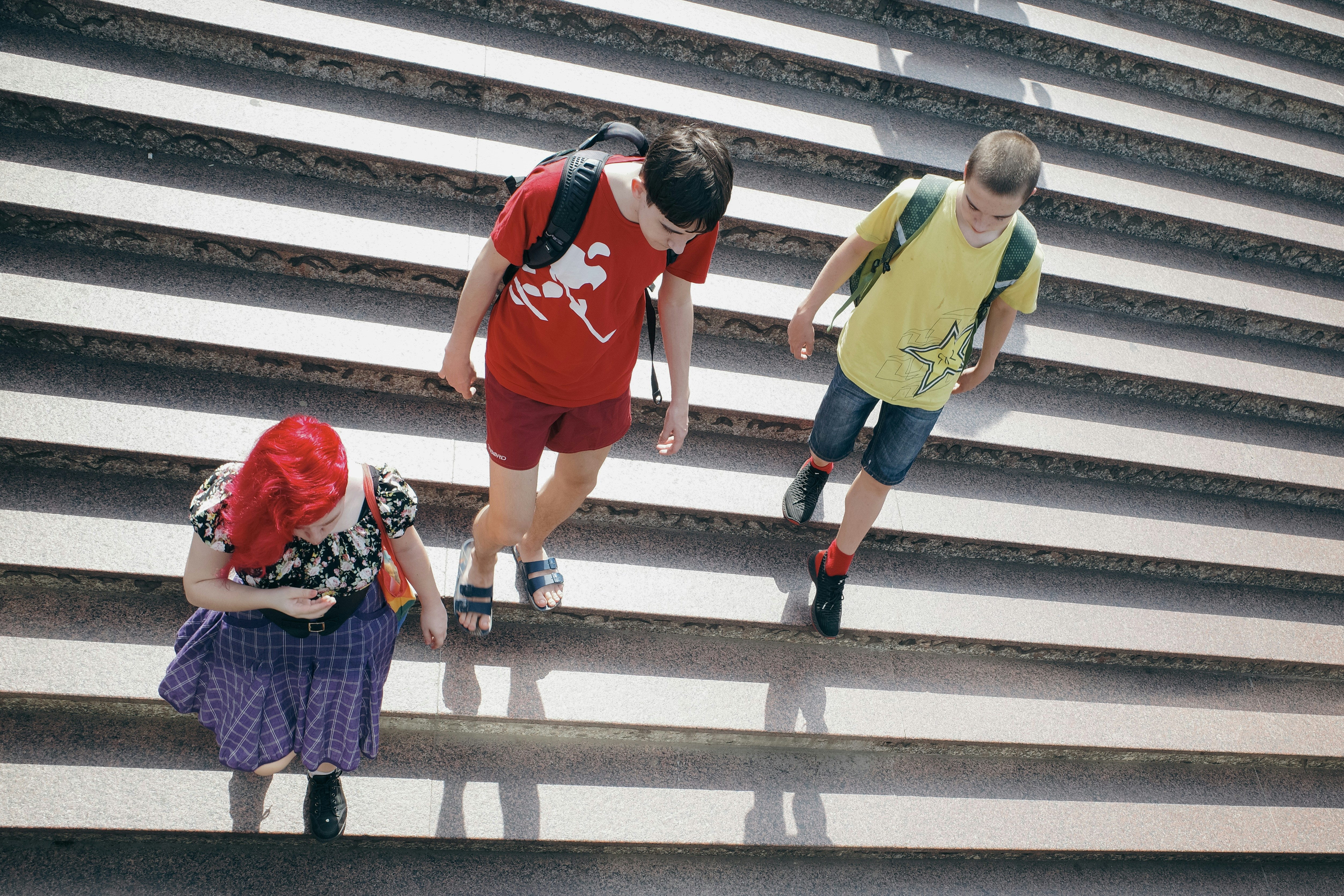 A group of people walking up a flight of stairs