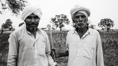 A couple of men standing next to each other