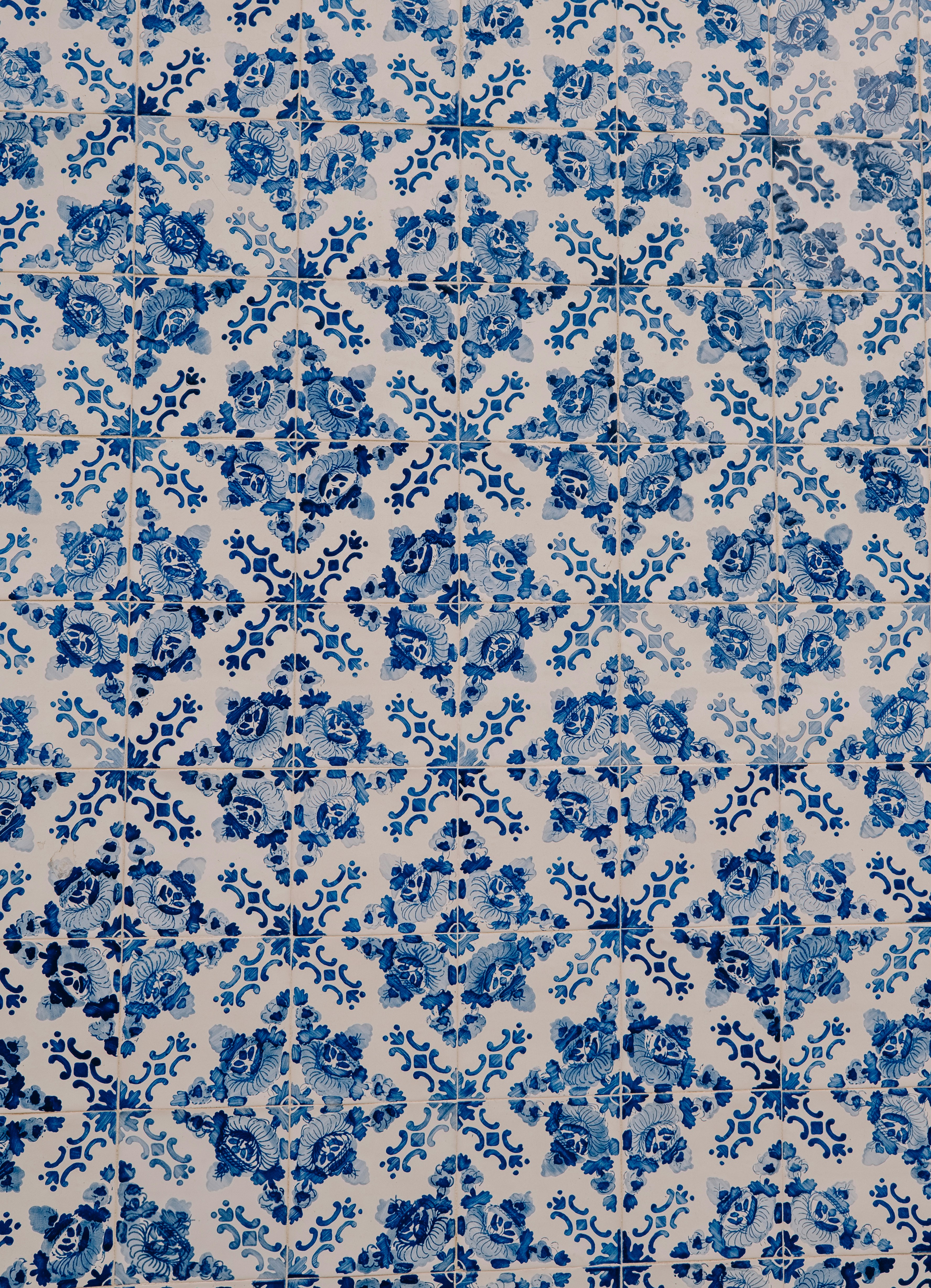 A blue and white rug with a design on it
