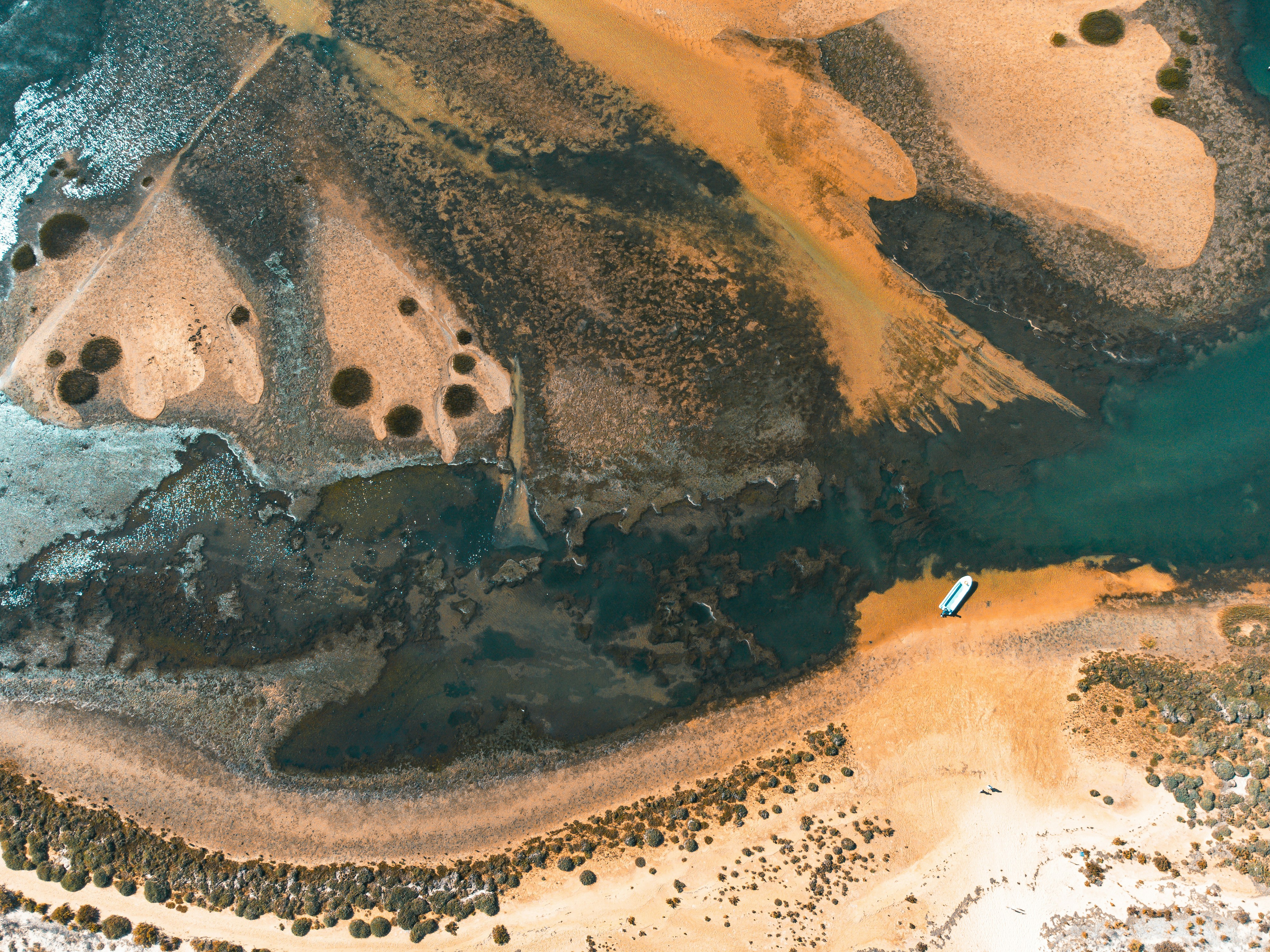 A bird's eye view of a beach and a body of water
