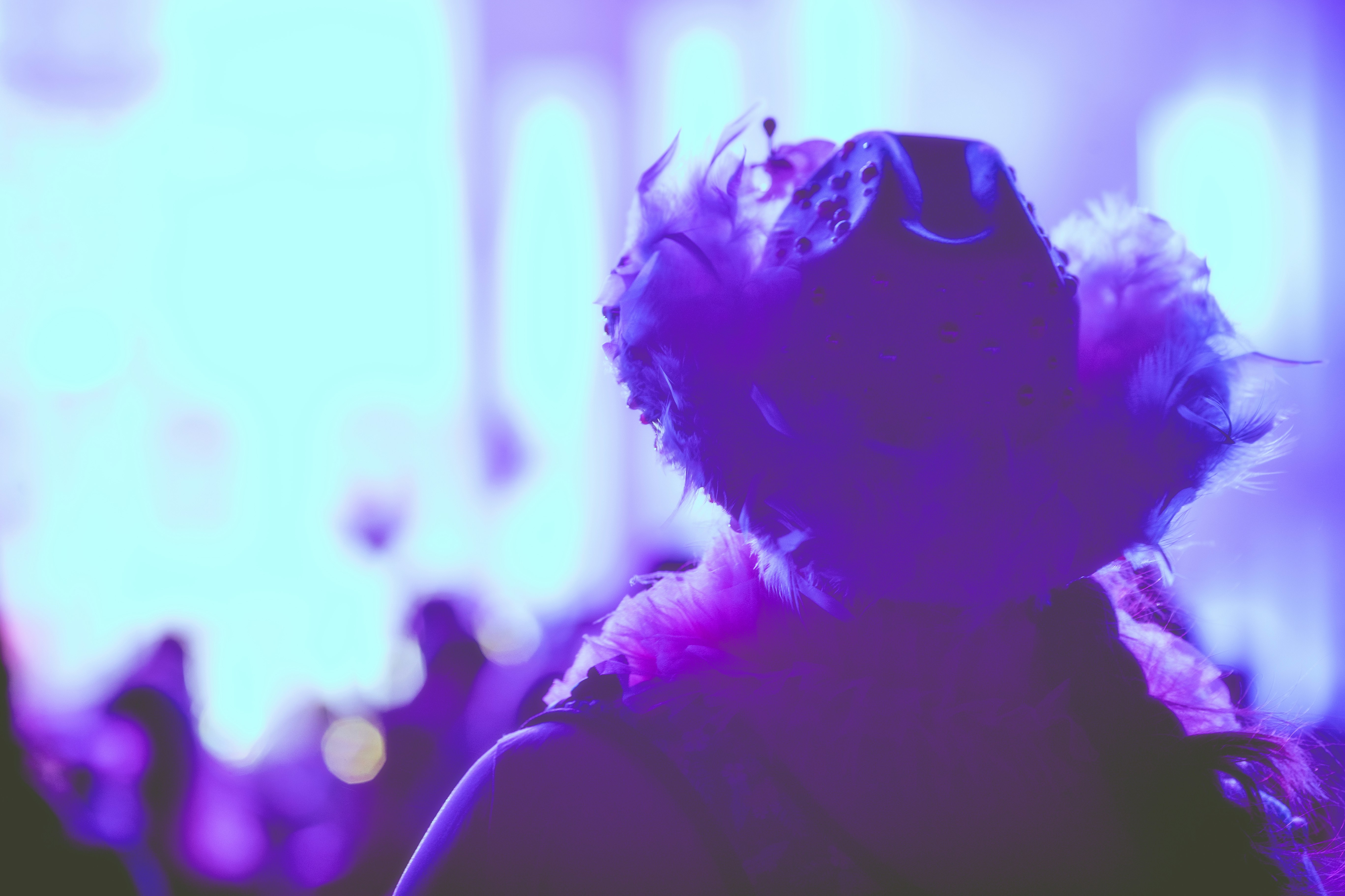 A blurry image of a person wearing a hat