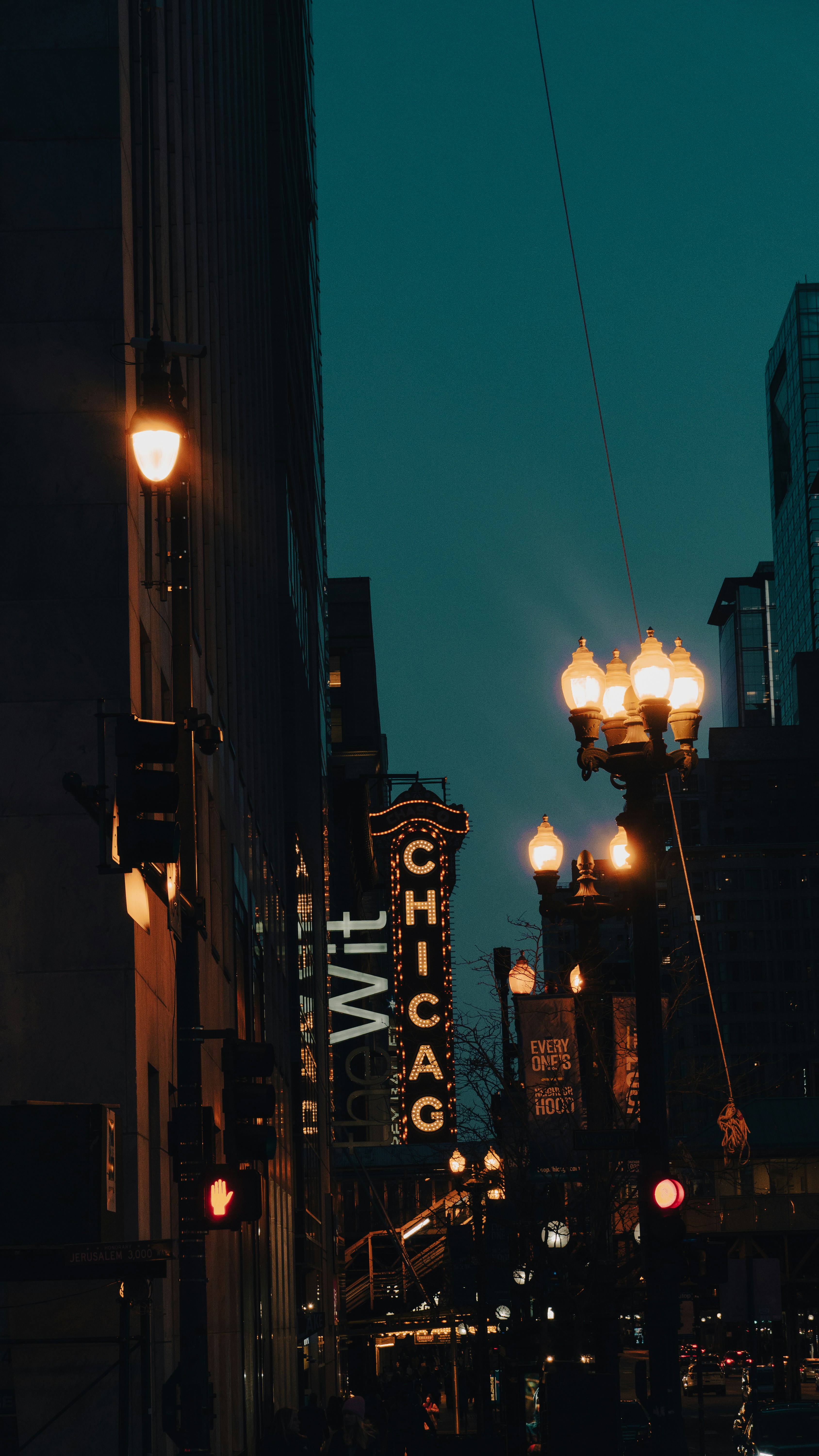 A city street filled with lots of tall buildings