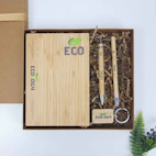 A wooden box with a bamboo keychain and a bamboo box with a bamboo