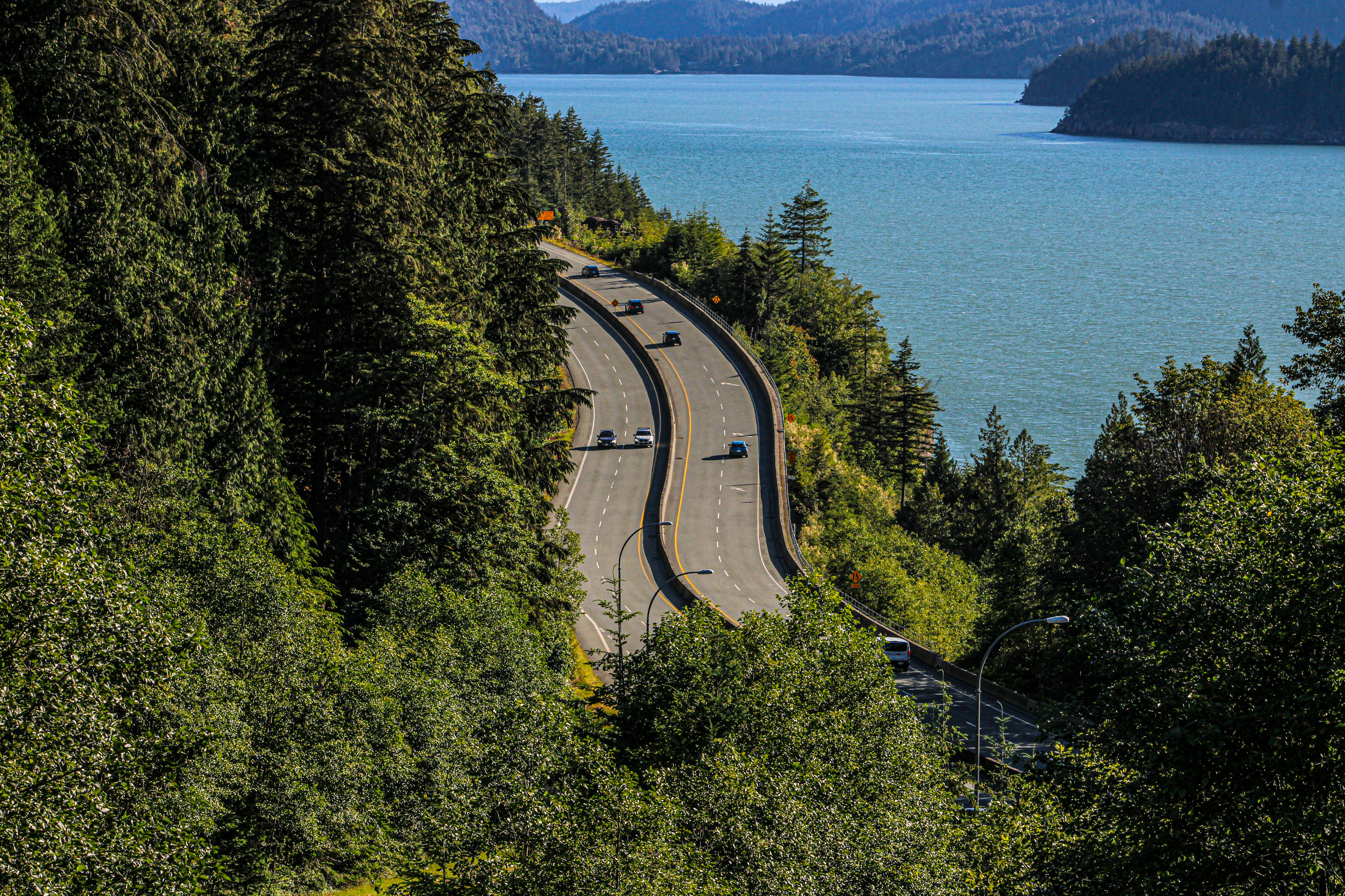 A scenic view of a road near a body of water