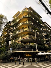 A very tall building with many balconies on it