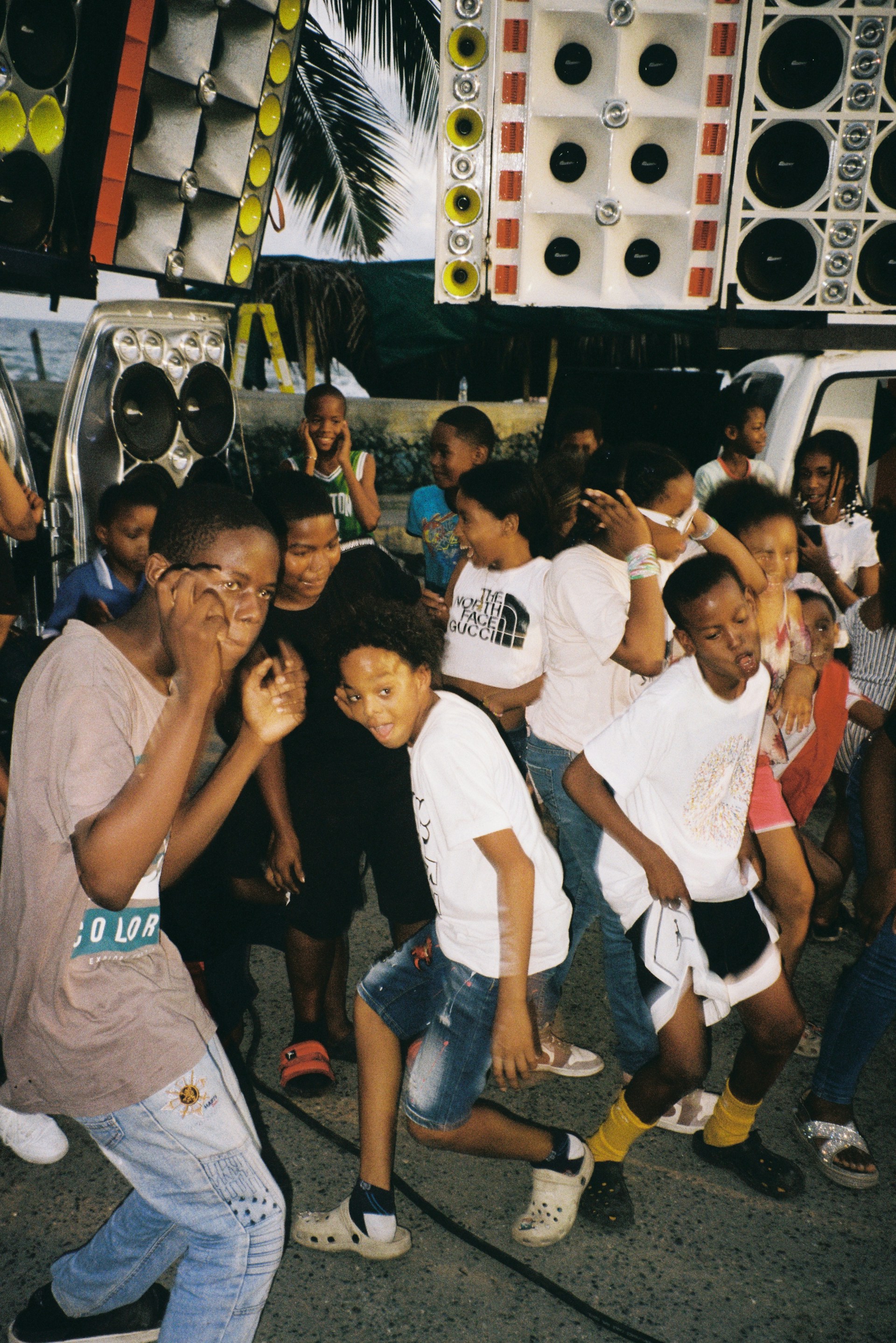 A group of people standing around each other