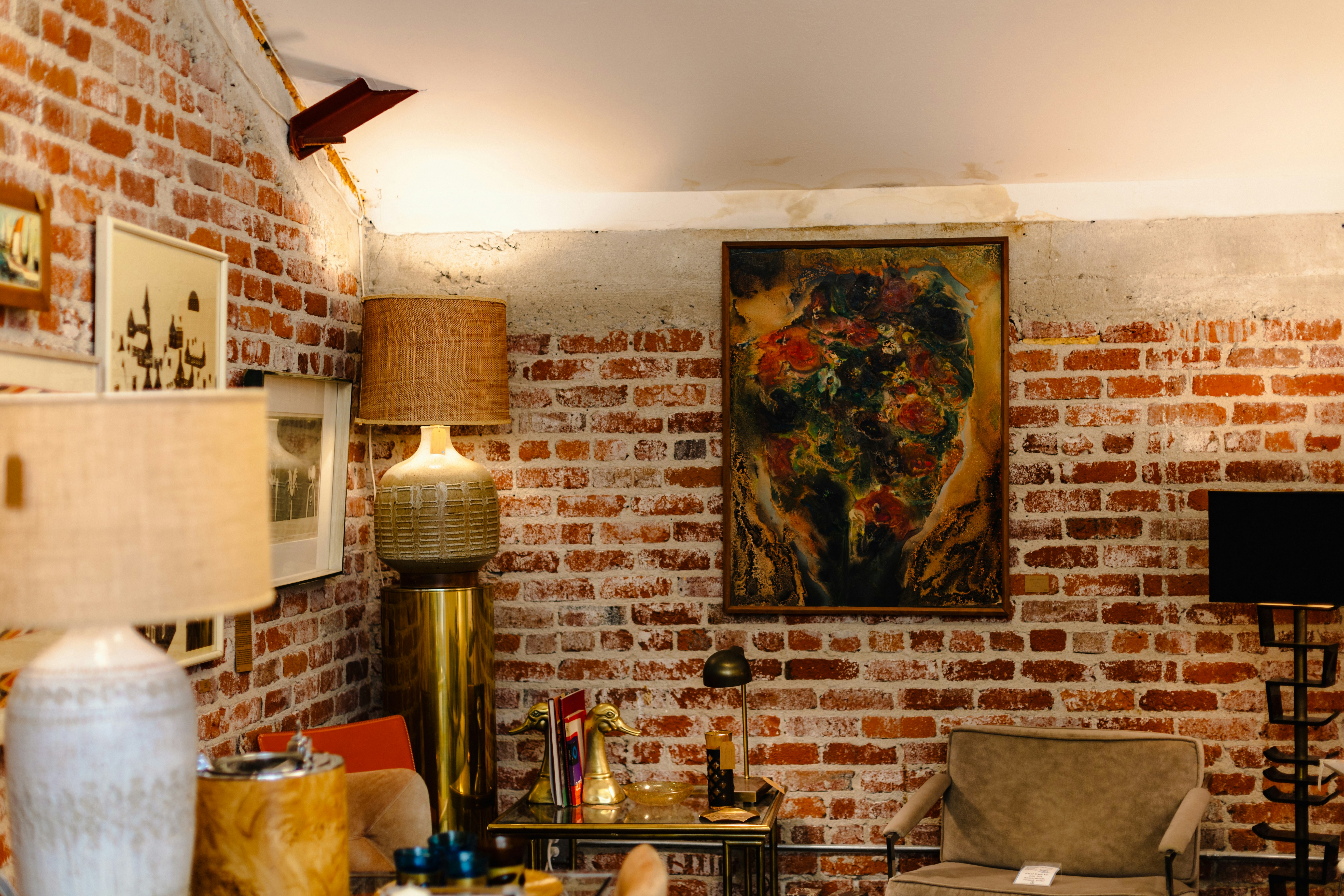 exposed brick and ductwork in a chic loft living room - loft meaning