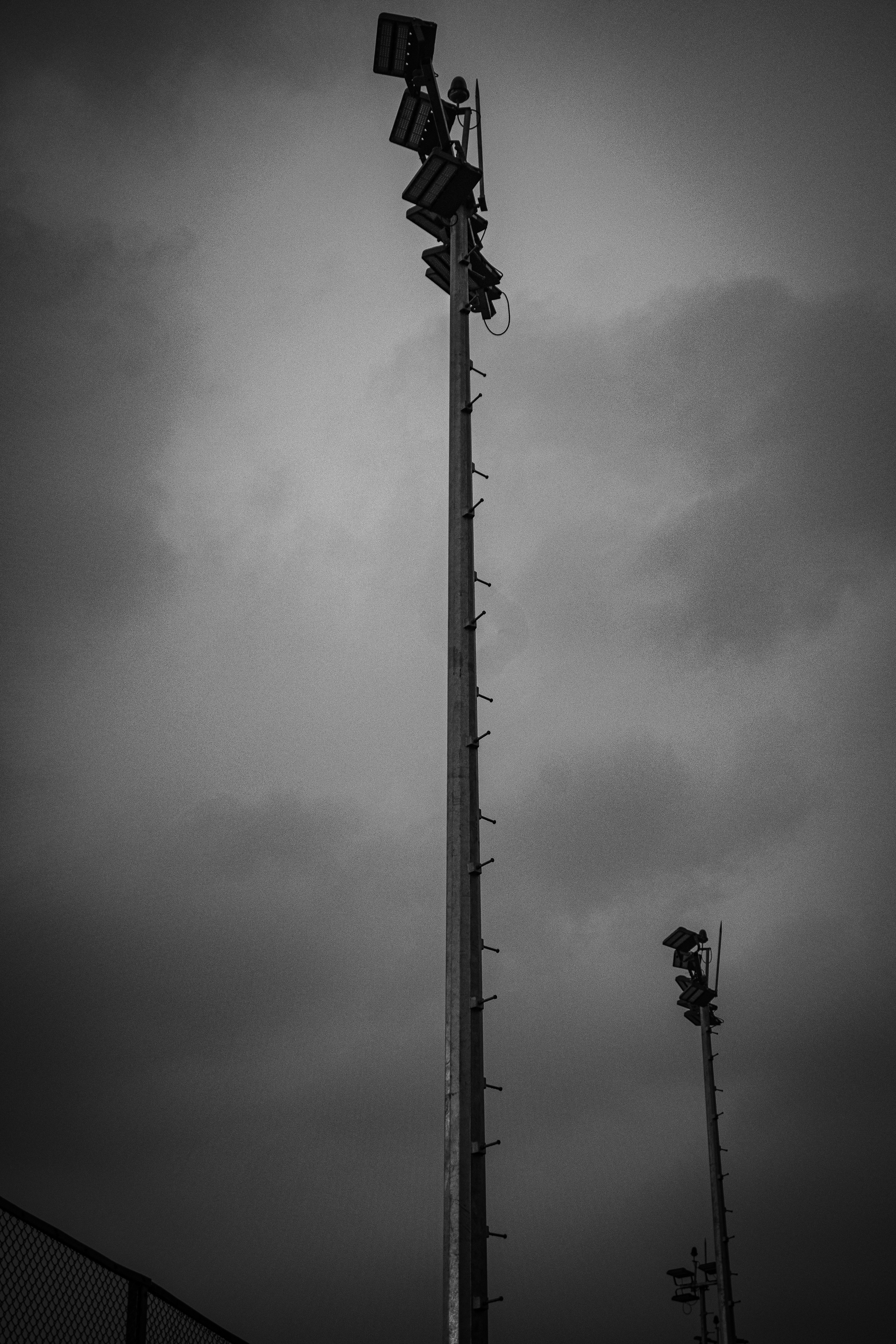 A black and white photo of a street light