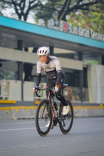 A man riding a bike down a street