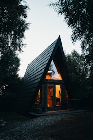 A small wooden cabin with a pitched roof