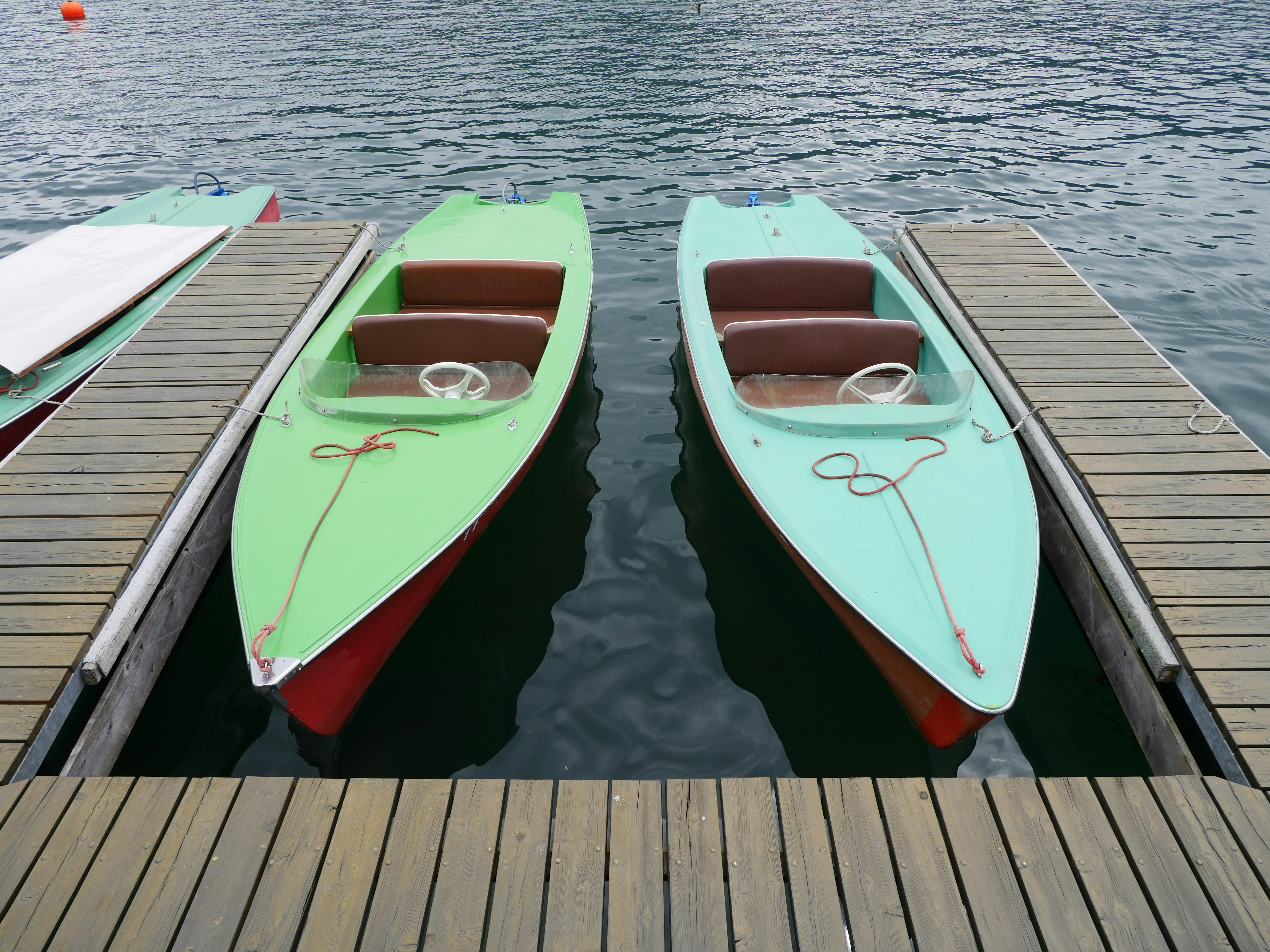 A couple of boats that are sitting in the water