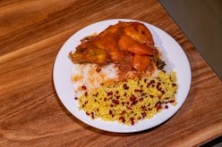 A plate of food on a wooden table